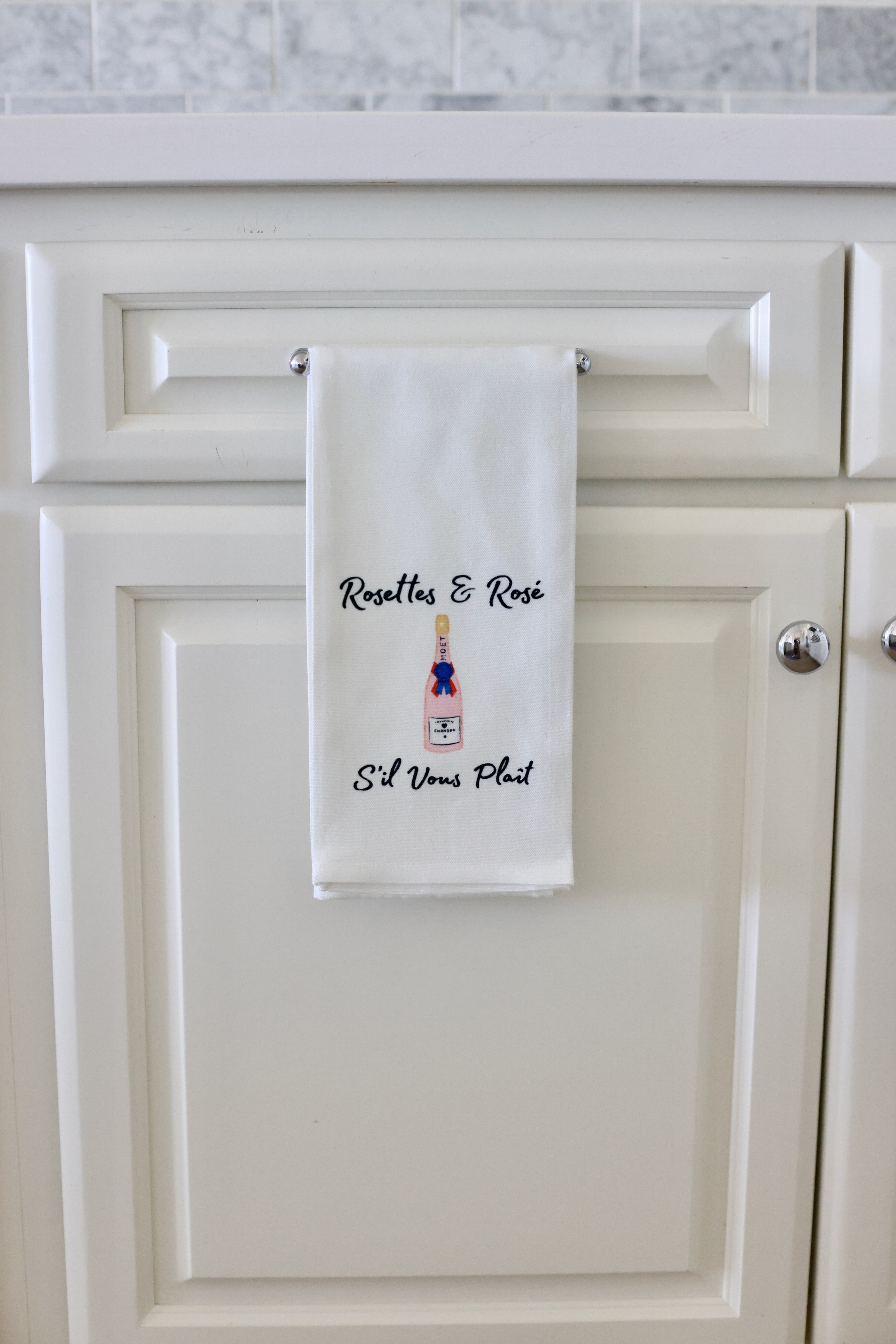 Towel with Roselles & Rosé design hanging on a kitchen cabinet. - equestrian kitchen and dining, horse themed linen, equestrian hosting