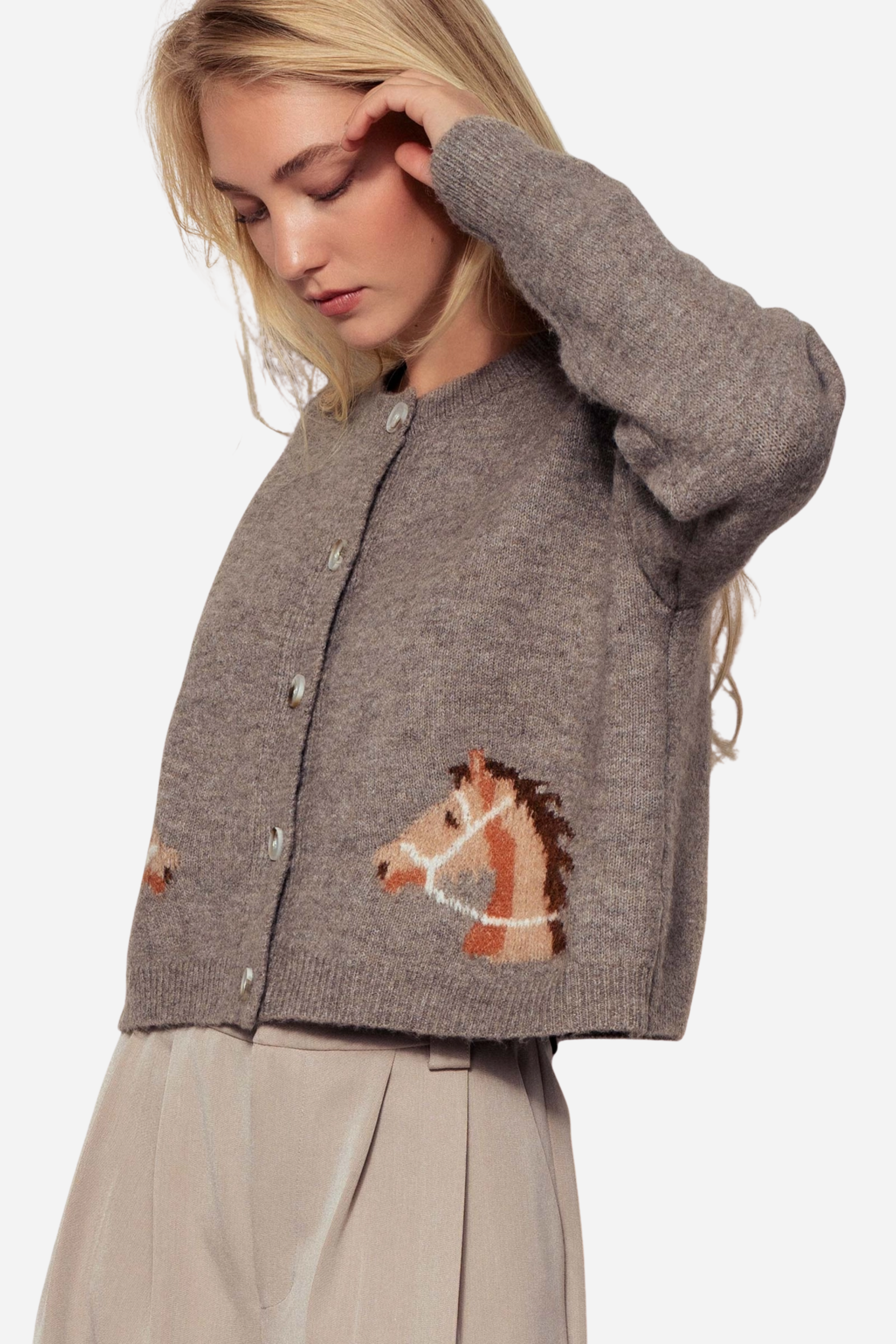 Gray knit cardigan with a crew neckline, button-front closure, and ribbed trim. Features playful horse head designs on each lower front panel, creating a rustic, equestrian-inspired look. Made from a soft acrylic-polyester-spandex blend in a relaxed, cropped fit.