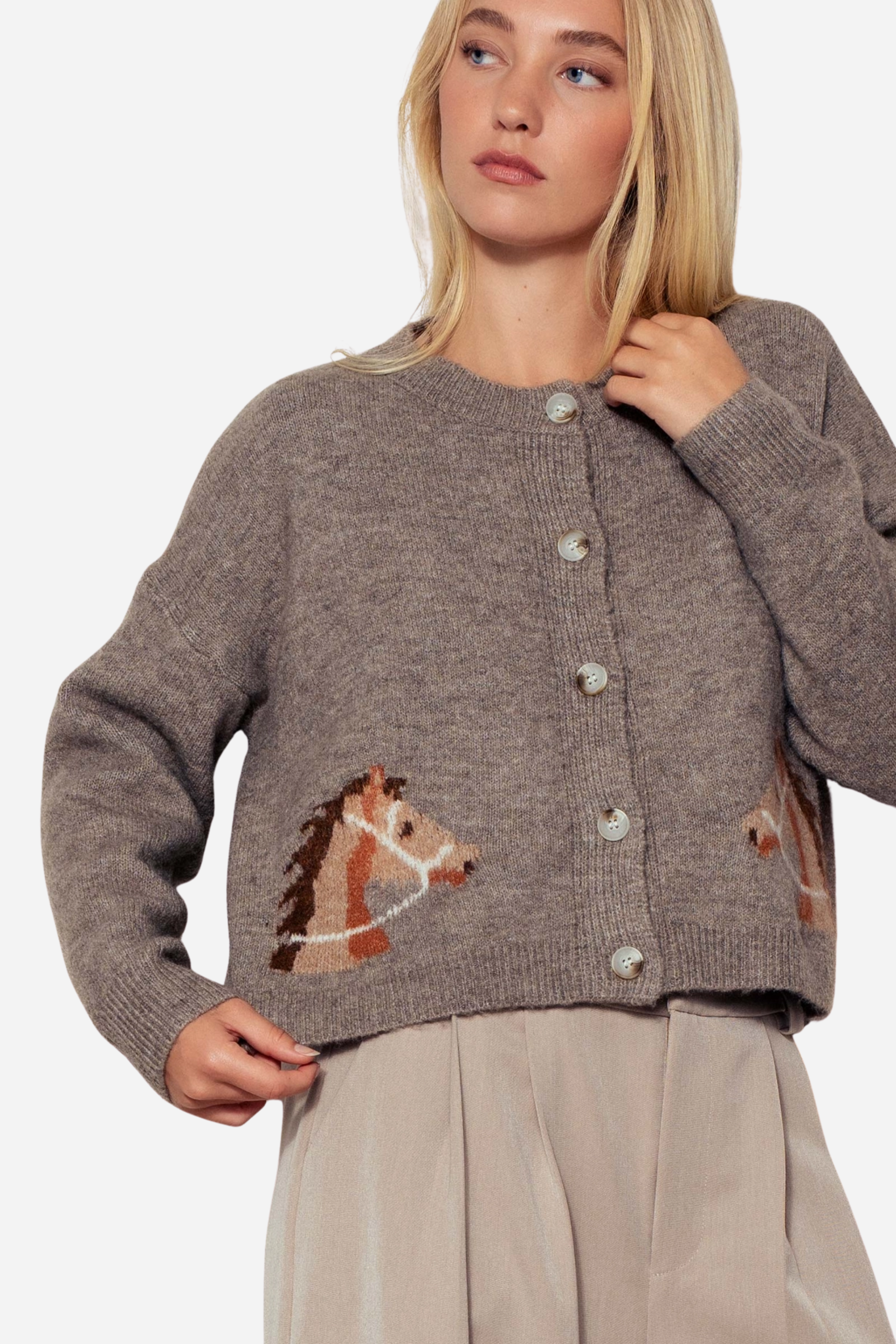Gray knit cardigan with a crew neckline, button-front closure, and ribbed trim. Features playful horse head designs on each lower front panel, creating a rustic, equestrian-inspired look. Made from a soft acrylic-polyester-spandex blend in a relaxed, cropped fit.