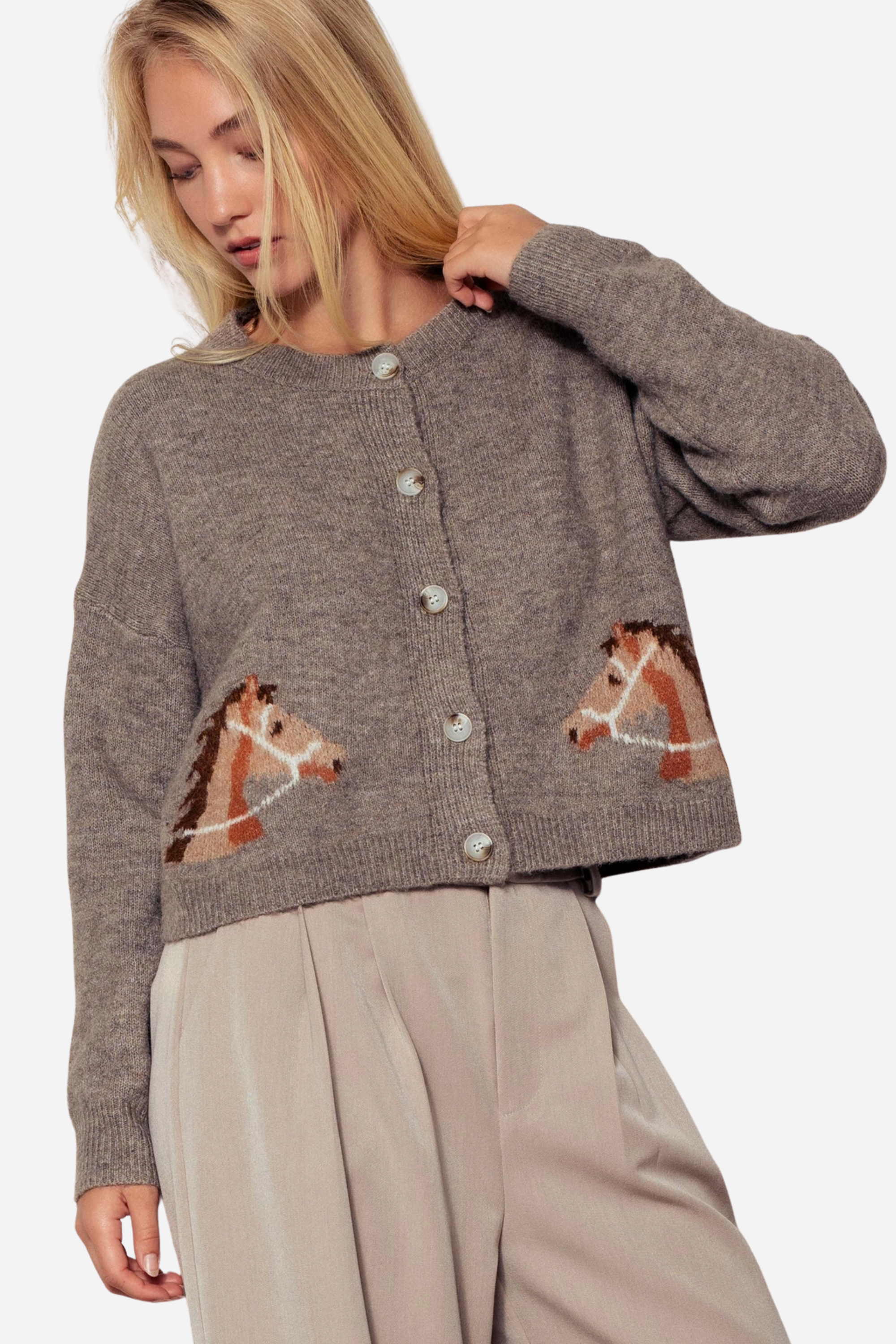 Gray knit cardigan with a crew neckline, button-front closure, and ribbed trim. Features playful horse head designs on each lower front panel, creating a rustic, equestrian-inspired look. Made from a soft acrylic-polyester-spandex blend in a relaxed, cropped fit.
