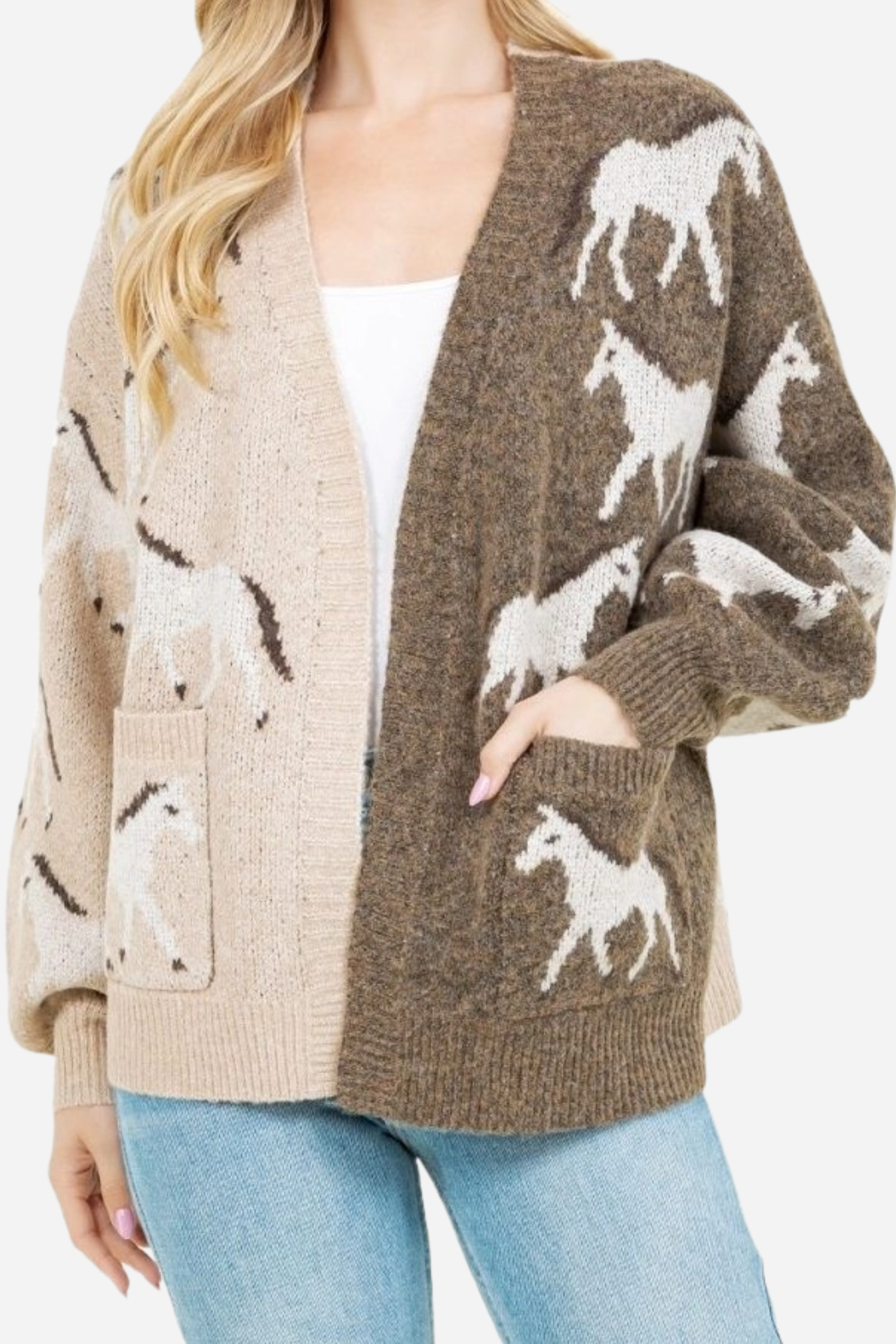 Woman wearing an asymmetric open-front cardigan in brown and beige with white horse patterns. This cozy equestrian cardigan blends rustic western style with casual horse girl apparel, soft, stretchy knit perfect for everyday wear.