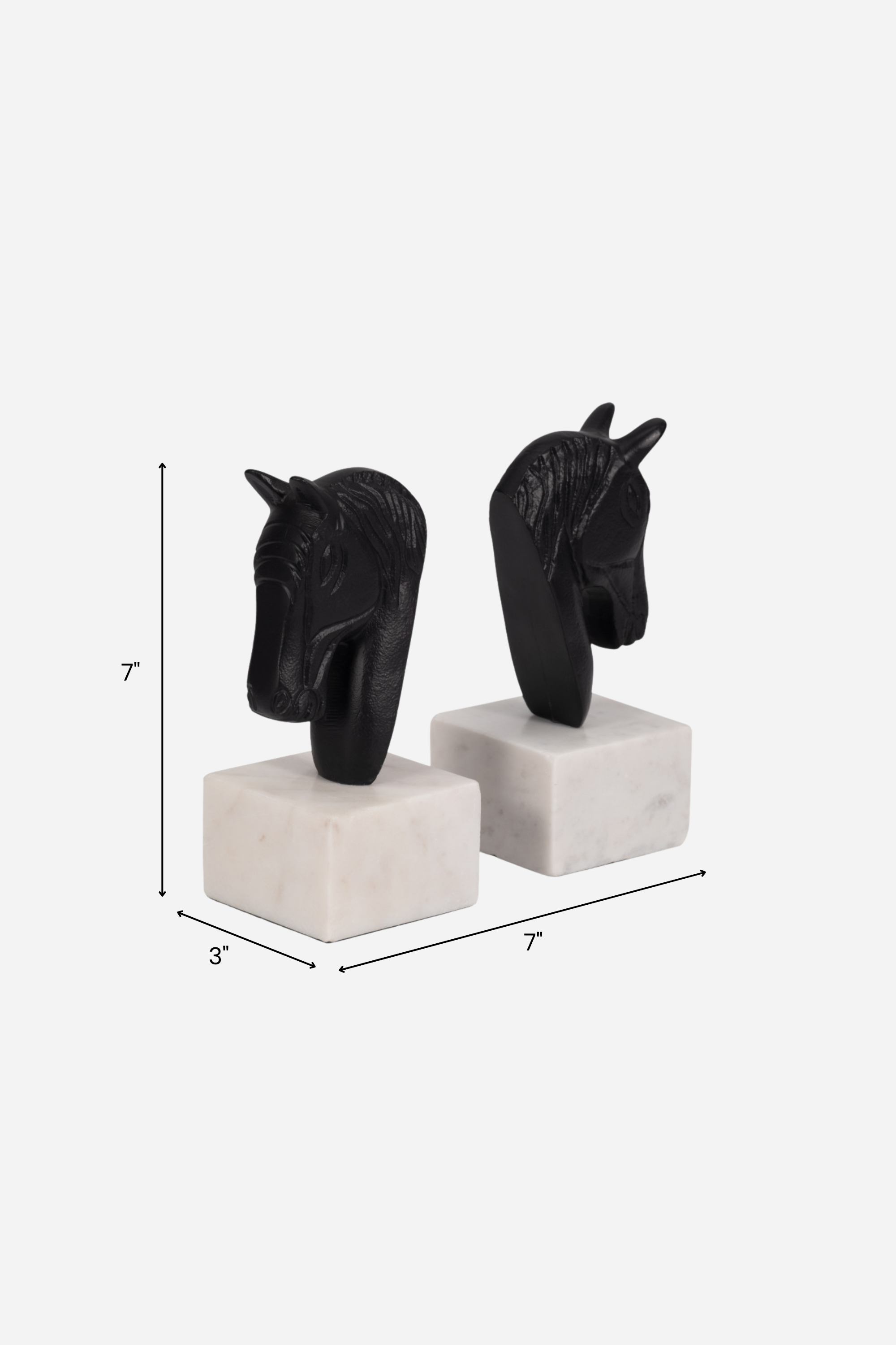 Set of two metal horse head bookends with sleek black and white aluminum design and solid marble bases. Elegant equestrian-inspired home décor perfect for elevating a bookshelf, office, or home library while securely holding books with timeless style.