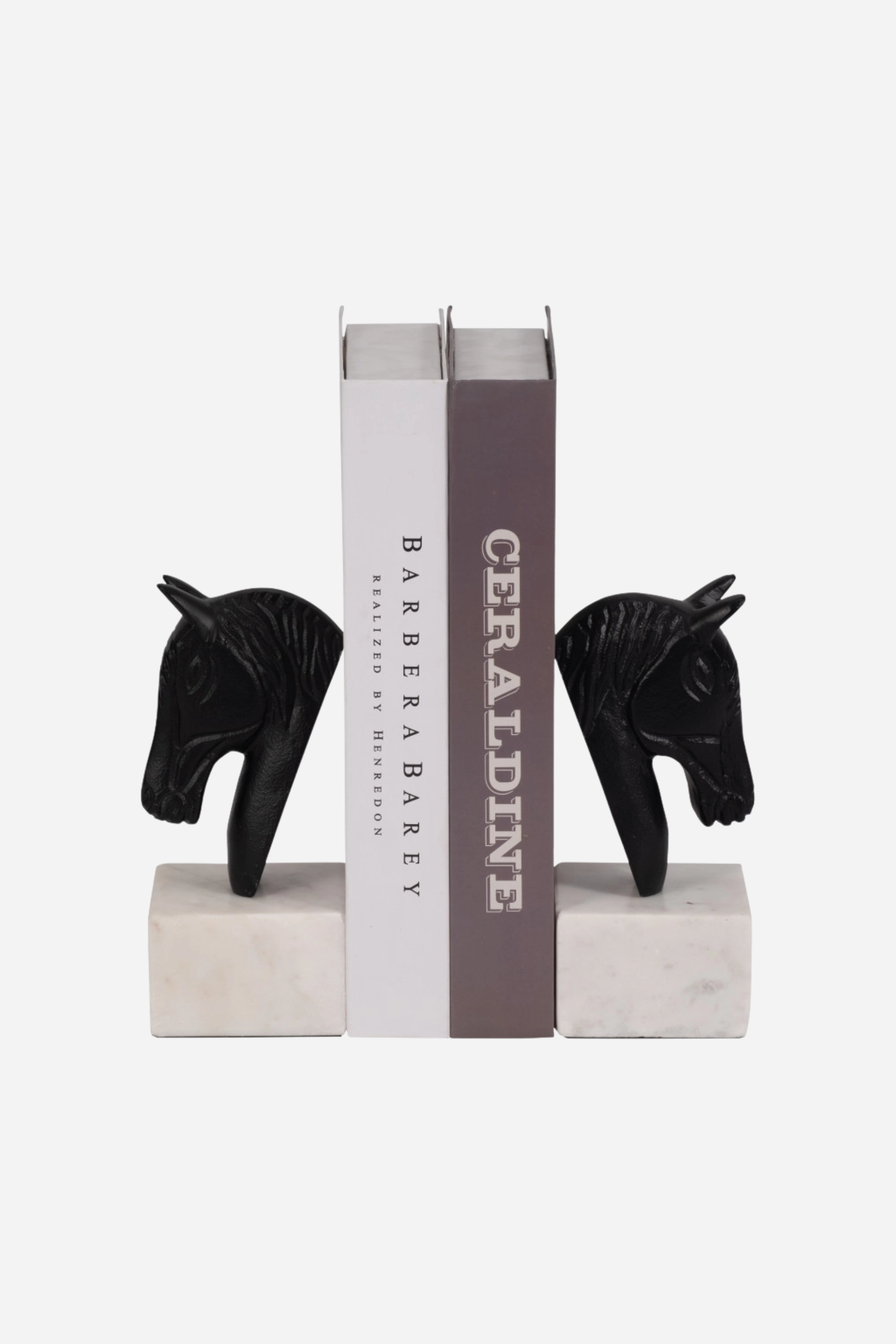 Set of two metal horse head bookends with sleek black and white aluminum design and solid marble bases. Elegant equestrian-inspired home décor perfect for elevating a bookshelf, office, or home library while securely holding books with timeless style.