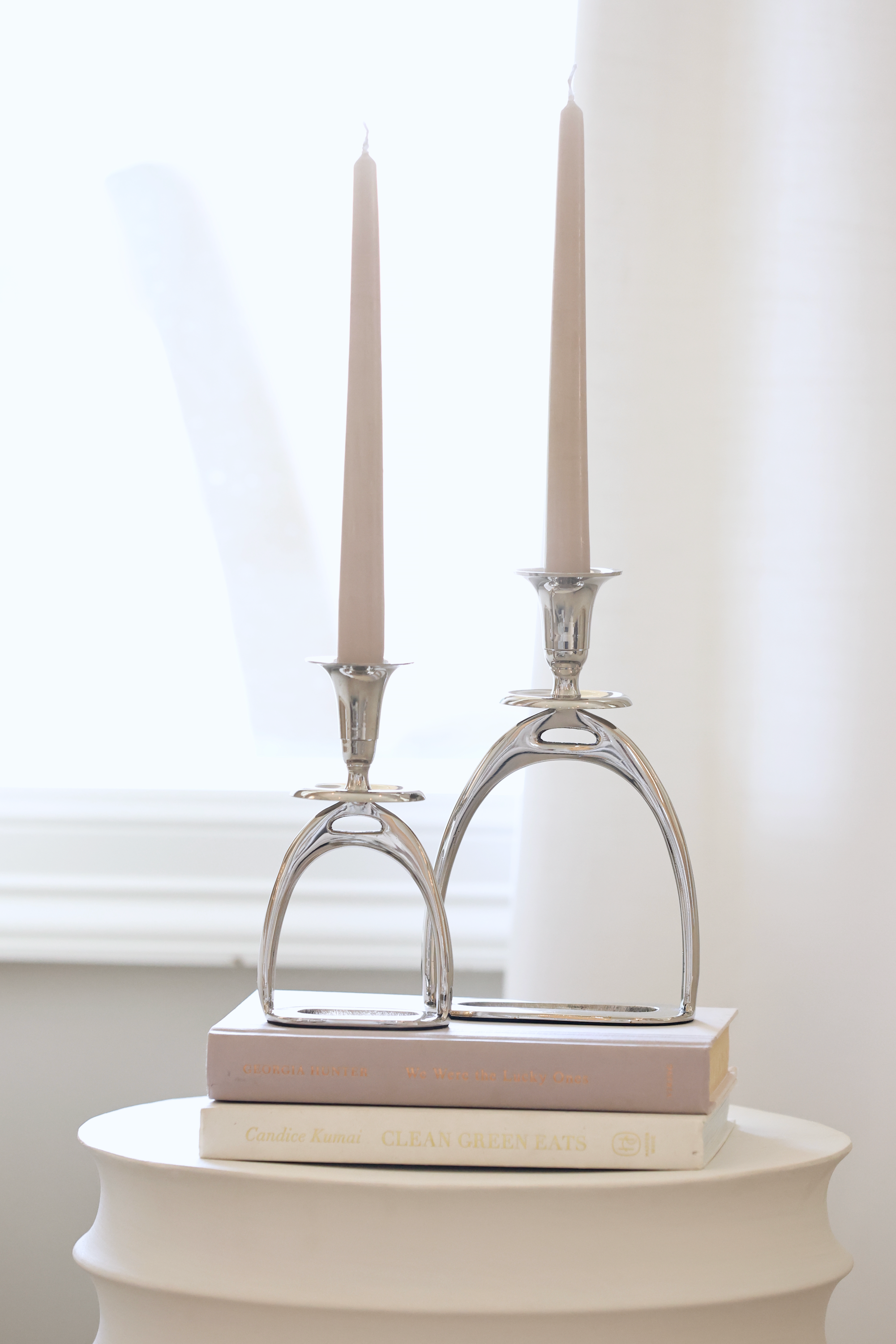 thg stylish equestrian silver stirrup candle stick holder set Silver Stirrup Candle Holder featuring a polished equestrian stirrup design that holds tapered candles. Available in small (6") and large (10") sizes, this elegant home accent adds refined equestrian charm to any space.