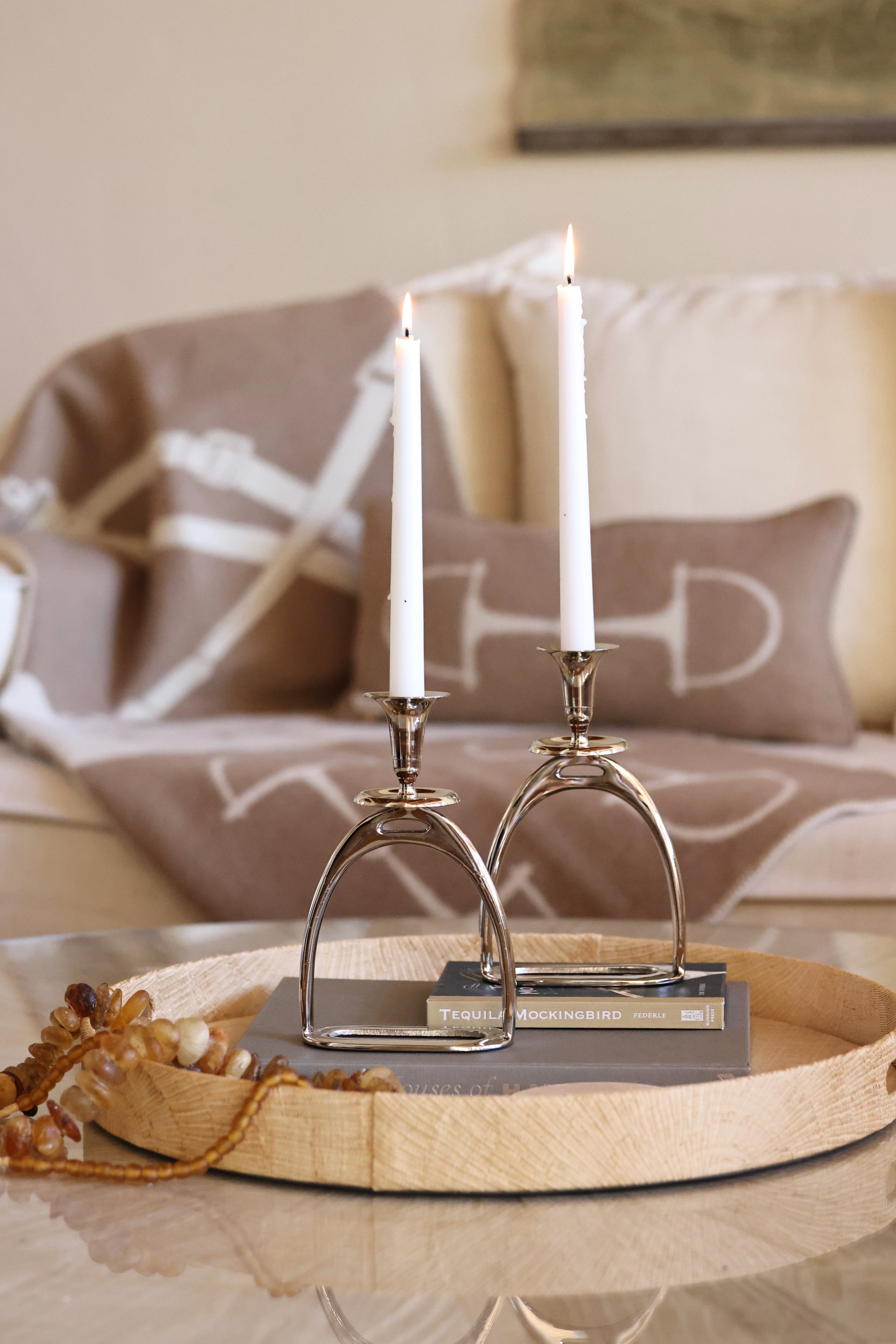 thg stylish equestrian silver stirrup candle stick holder set Silver Stirrup Candle Holder featuring a polished equestrian stirrup design that holds tapered candles. Available in small (6") and large (10") sizes, this elegant home accent adds refined equestrian charm to any space.