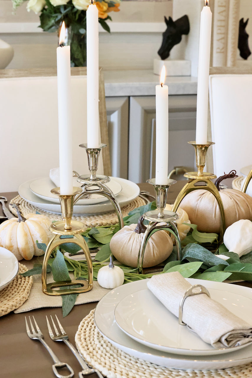 thg stylish equestrian silver stirrup candle stick holder set Silver Stirrup Candle Holder featuring a polished equestrian stirrup design that holds tapered candles. Available in small (6") and large (10") sizes, this elegant home accent adds refined equestrian charm to any space.