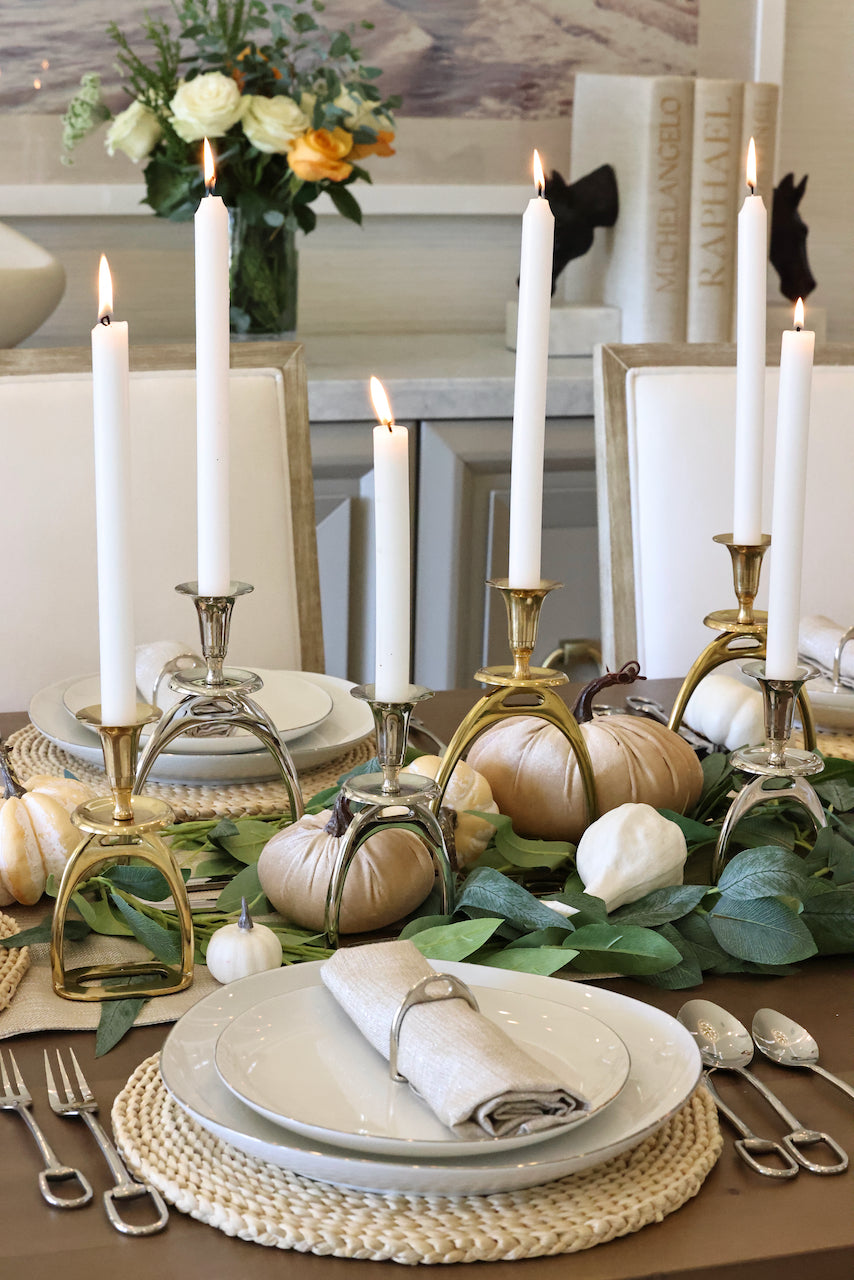 thg stylish equestrian silver stirrup candle stick holder set Silver Stirrup Candle Holder featuring a polished equestrian stirrup design that holds tapered candles. Available in small (6") and large (10") sizes, this elegant home accent adds refined equestrian charm to any space.