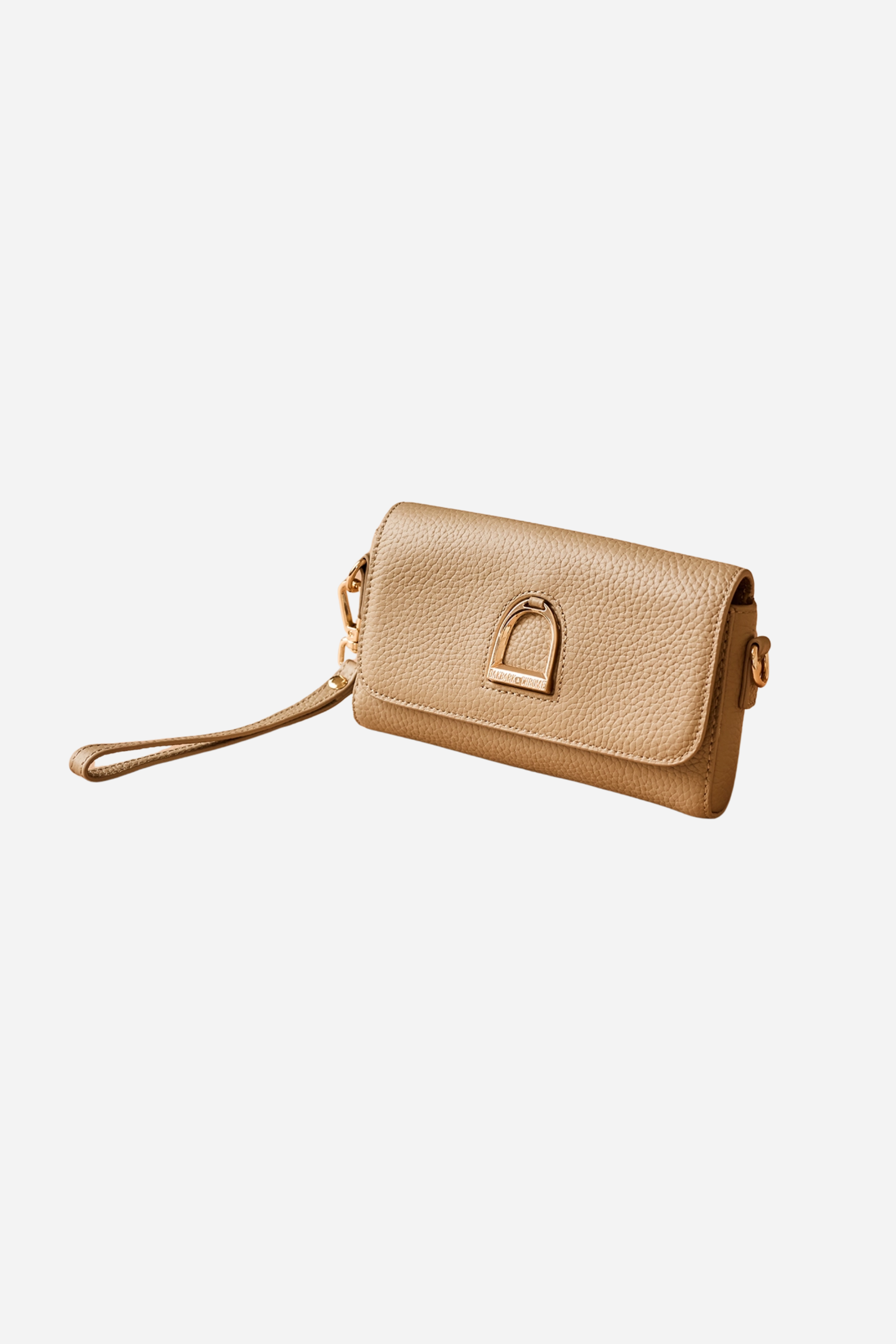 Equestrian leather belt bag made from pebbled leather with a gold stirrup emblem, interchangeable wristlet and adjustable straps, and lined interior.