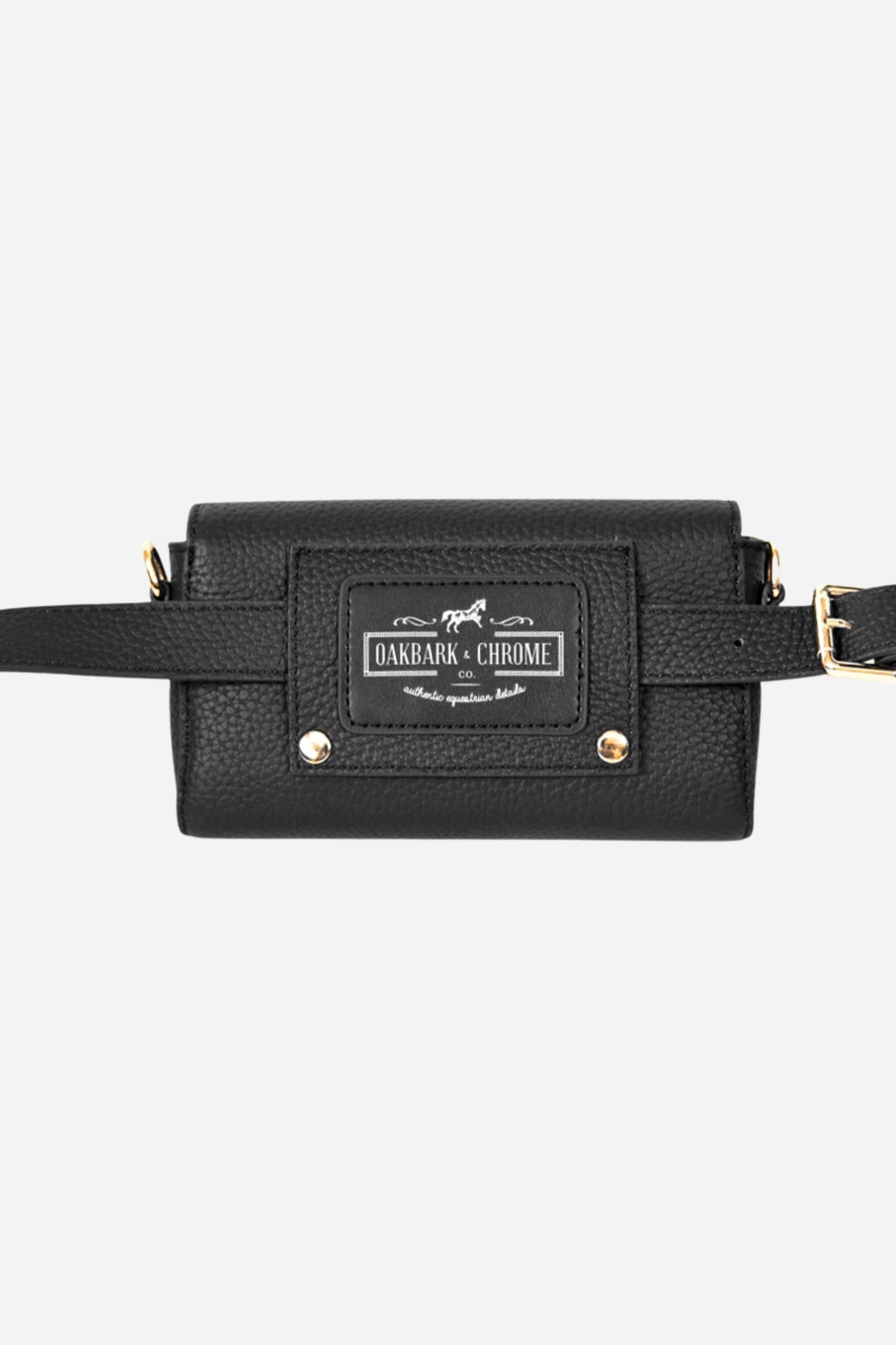 Oakbark & Chrome Stirrup Leather Belt Bag | A black leather clutch with a textured finish and gold accents. It features a gold clasp logo and a detachable wrist strap | Equestrian belt bag, black leather wristlet clutch, stirrup emblem purse, adjustable strap crossbody bag, pebbled leather belt bag, gold hardware equestrian bag, stylish horse girl accessory, small leather equestrian purse, Oakbark & Chrome belt bag, equestrian-inspired designer clutch
