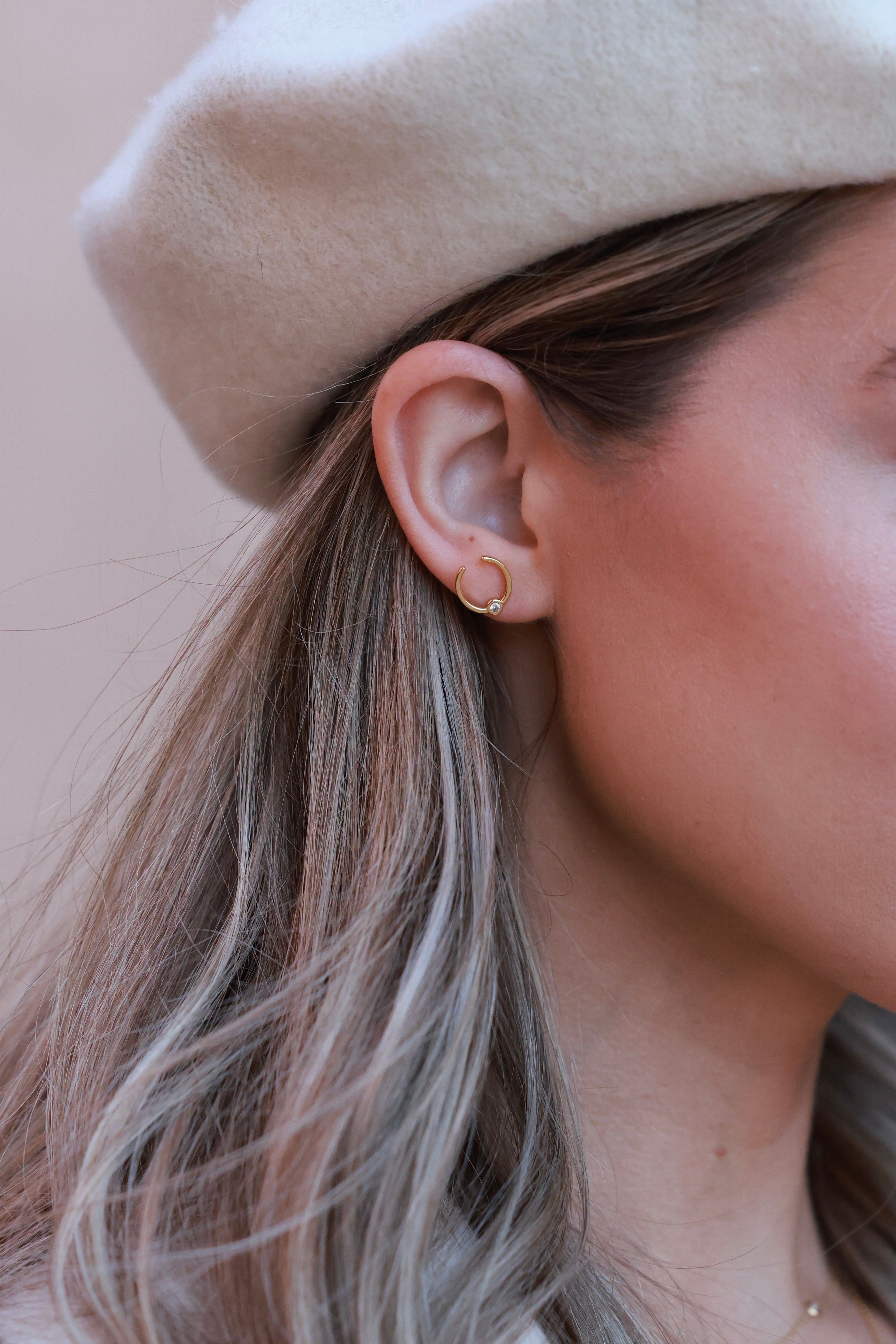 Sutton Horseshoe Earrings in 14k gold vermeil featuring delicate horseshoe design adorned with sparkling Swarovski crystals. Lightweight and elegant equestrian-inspired jewelry that adds timeless charm and subtle brilliance — perfect for horse lovers.