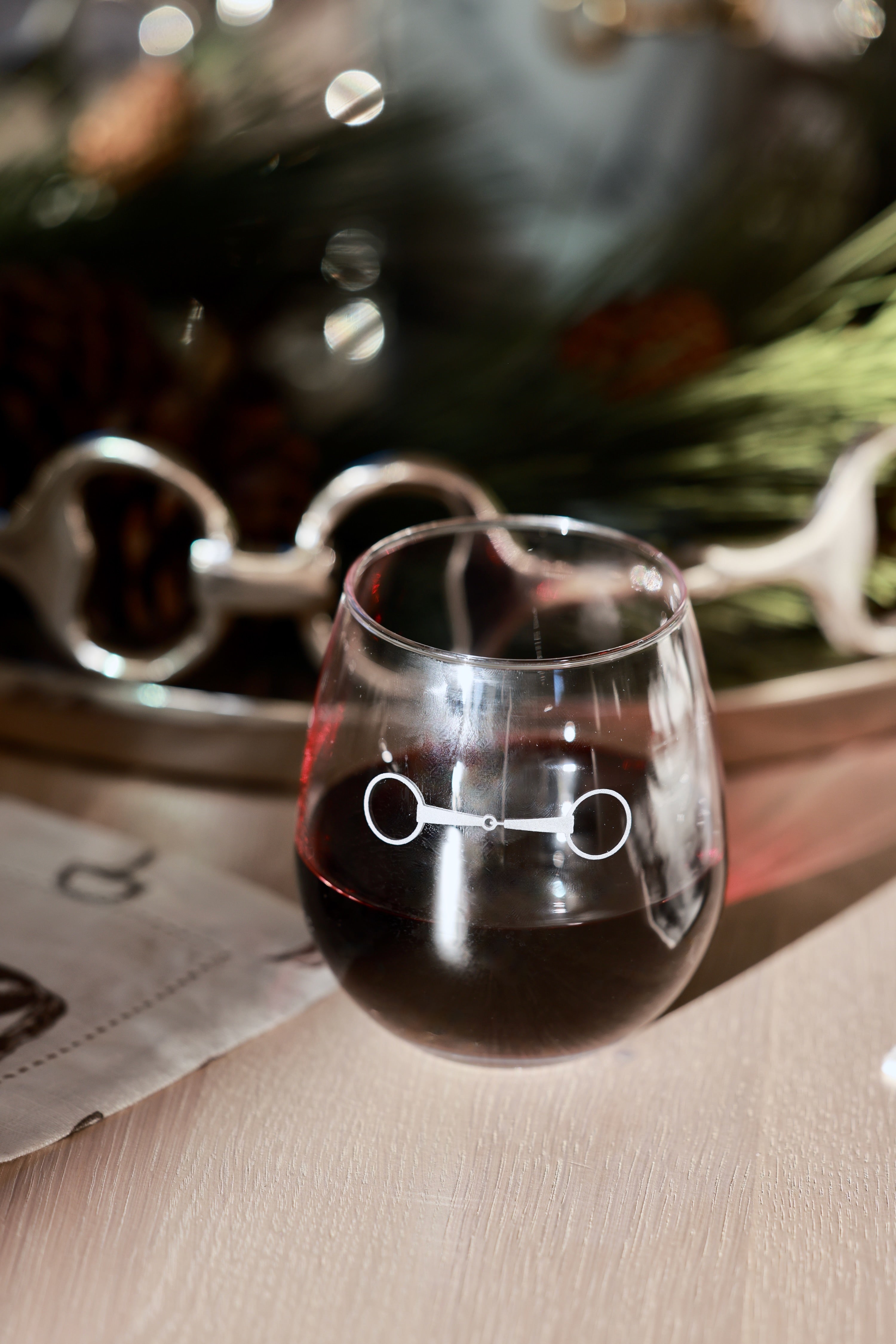 Troop of Horses Stemless Glass Set by Stylish Equestrian — elegant set of four 16 oz. stemless glasses, each hand-sandblasted with a unique horse bit design. Perfect equestrian-inspired glassware for entertaining, gifting, or home bar styling. Adds refined horse lover charm to any table setting. equestrian kitchen and dining, horse themed glassware, equestrian barware, horse bit wine glass set, luxury equestrian home decor, horse lover gift, elegant equestrian entertaining