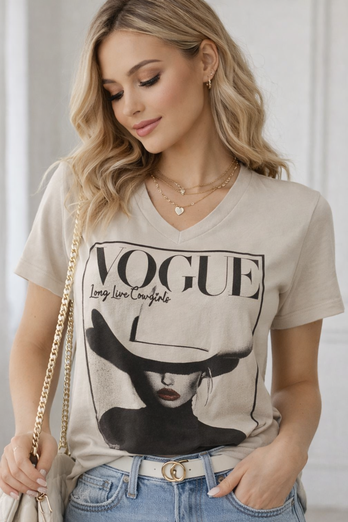 Vogue Cowgirl graphic tee with designer-inspired horse print, V-neck silhouette, made from 100% cotton.