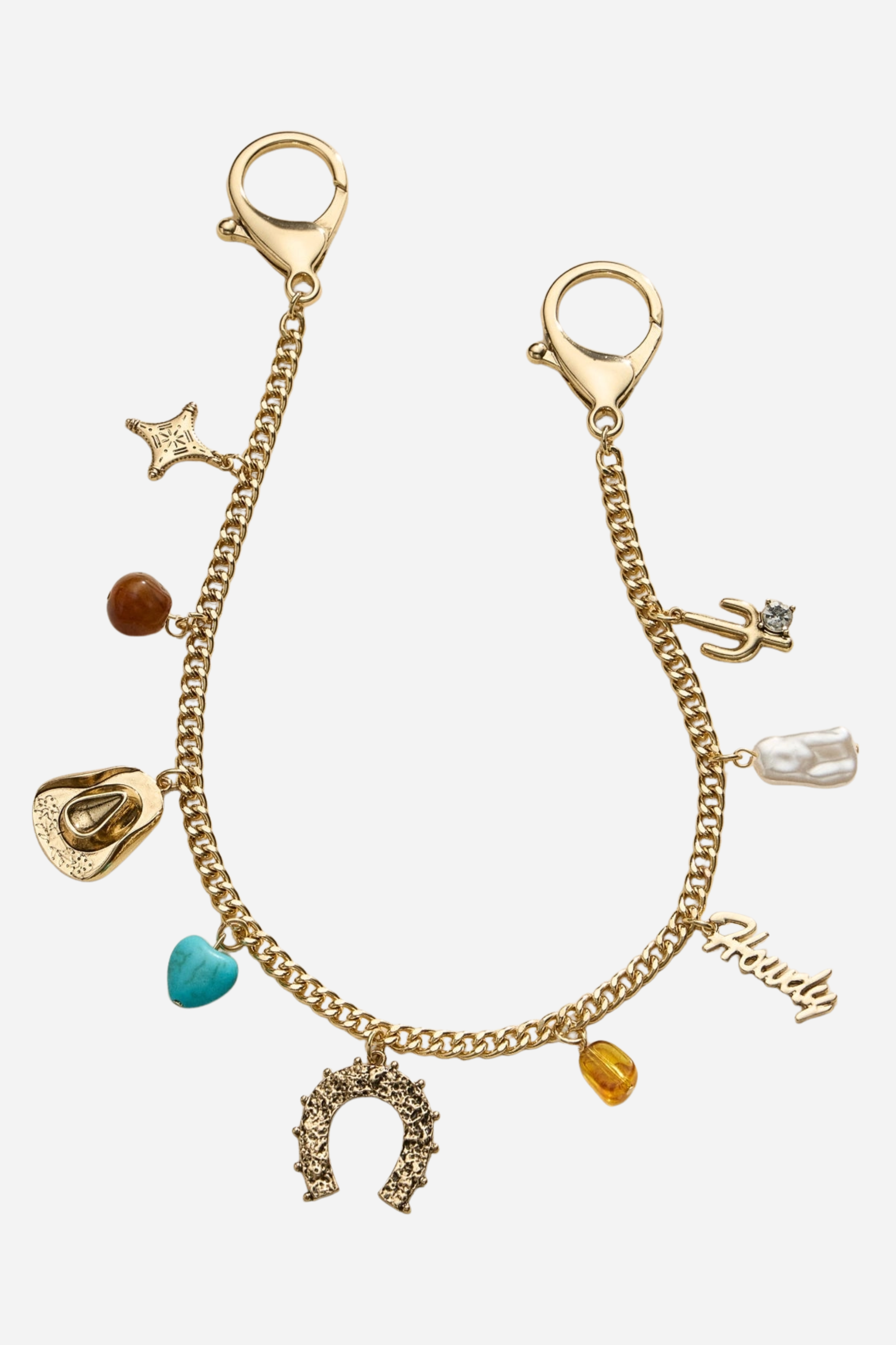 Gold-tone western bag charm chain adorned with a horseshoe, cowboy hat, and turquoise heart charms, designed to add equestrian flair to handbags.
