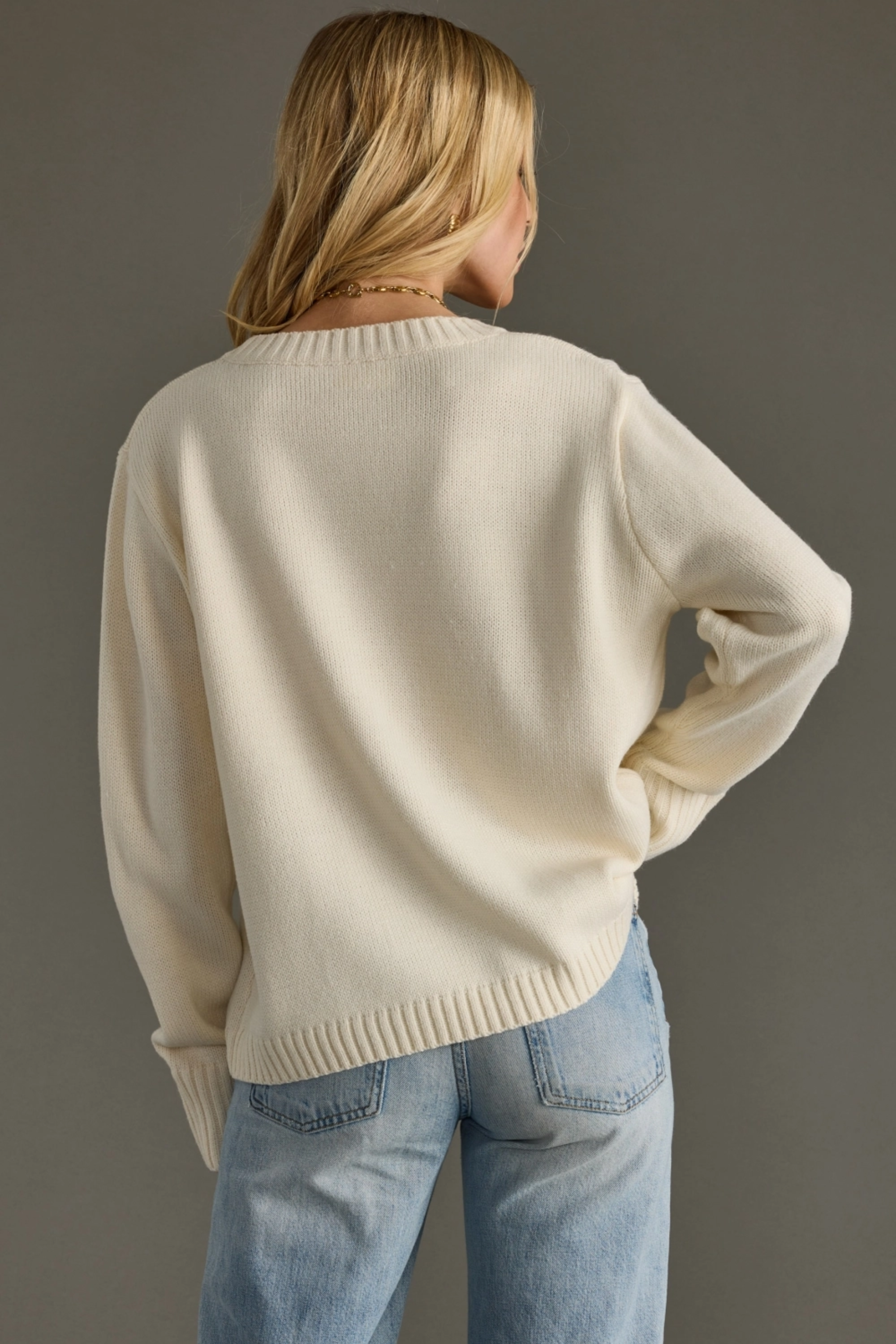 Woman wearing a beige sweater with 'WHISKEY WEATHER' text against a gray background - Whiskey weather sweater, Western graphic sweater, Fall country sweater, Ivory knit pullover, Cowgirl whiskey sweater