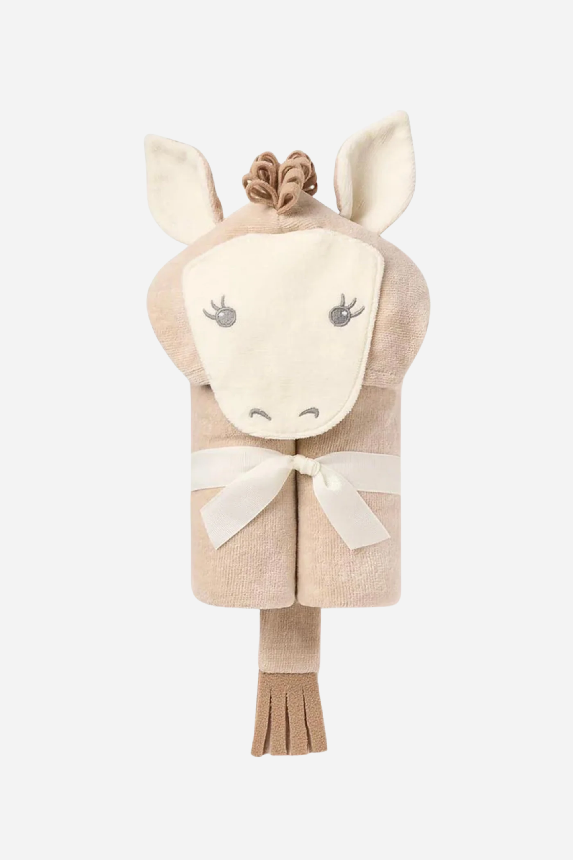 Soft beige hooded baby towel rolled and styled to look like a whimsical pony, featuring a stitched cartoon face, small fabric ears, and a fluffy mane. The towel is tied with a neat white ribbon, highlighting its cozy, giftable presentation. Ideal for newborns to 24 months, the 100% cotton velour terry fabric appears plush and soft, perfect for keeping little ones warm and dry after bath time.