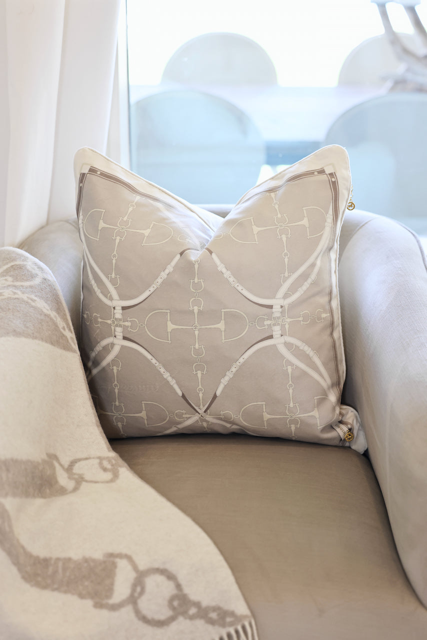 D-Ring Velvet Pillow – Putty by Stylish Equestrian, a luxurious 22x22 brushed velvet pillow featuring a modern equestrian D-ring bit pattern in soft neutral hues. Includes insert with side zip access and solid velvet backing for a refined finish. Perfect for adding equestrian charm and sophistication to any home décor. equestrian home decor and interior design, horse themed pillow, D-ring bit pillow, luxury velvet cushion, equestrian home furnishing, neutral horse decor, elegant equestrian accent
