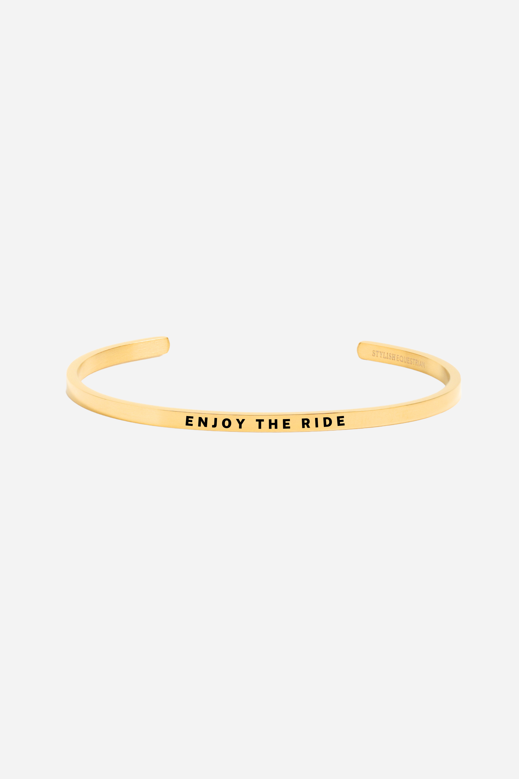 Enjoy The Ride Bangle available in gold and silver stainless steel. 18k gold-dipped, adjustable, tarnish-resistant, and lead-free equestrian bracelet. Perfect gift for horse lovers — Buy 2, Get 1 Free.