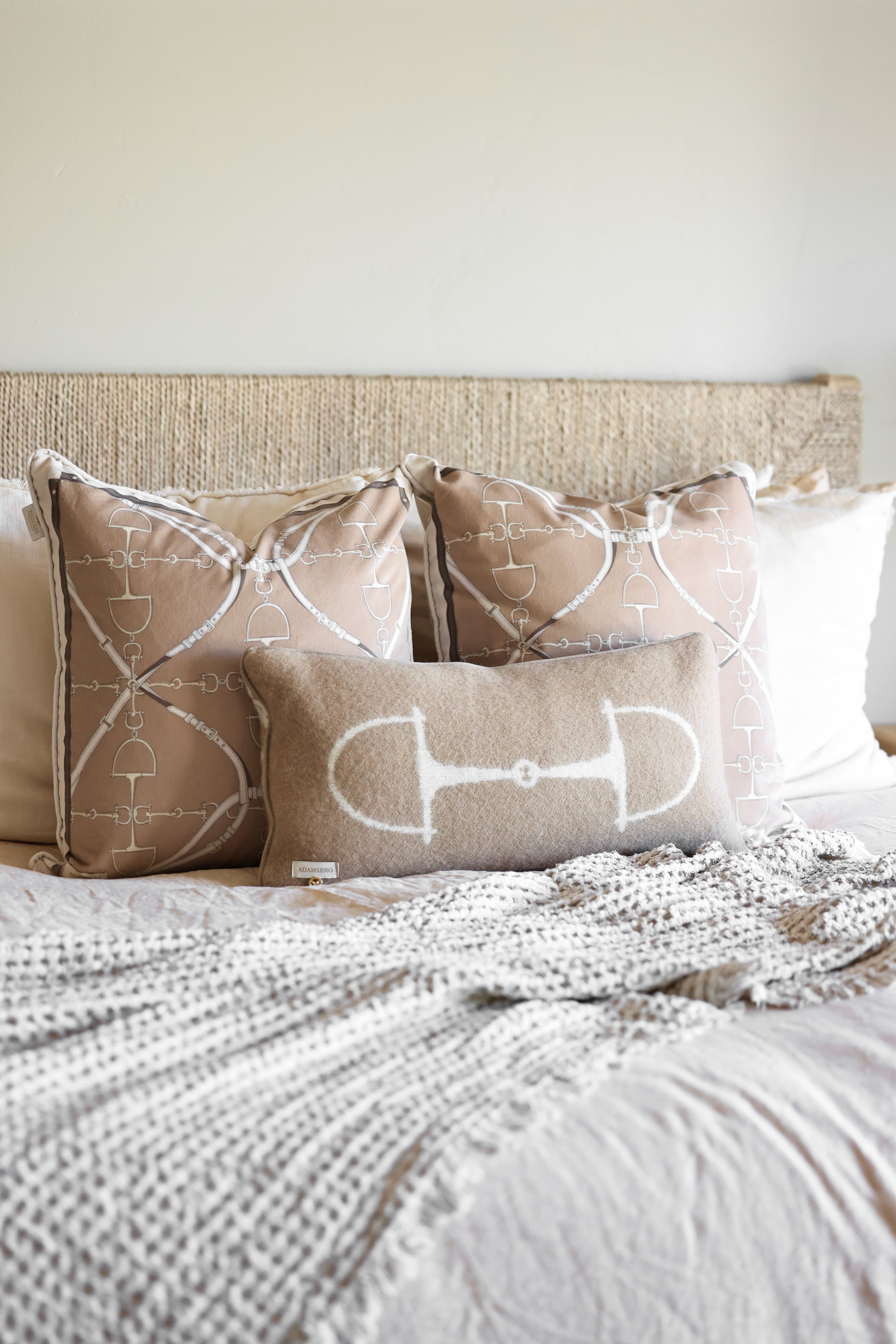 adamsbro stylish equestrian equine wool lumbar pillow Equine Lumbar Wool Pillow in Spice featuring a rich wool fabric with an elegant horse bit design, faux suede piping, and hidden zipper. A luxurious equestrian-inspired accent pillow perfect for home décor or bedding.