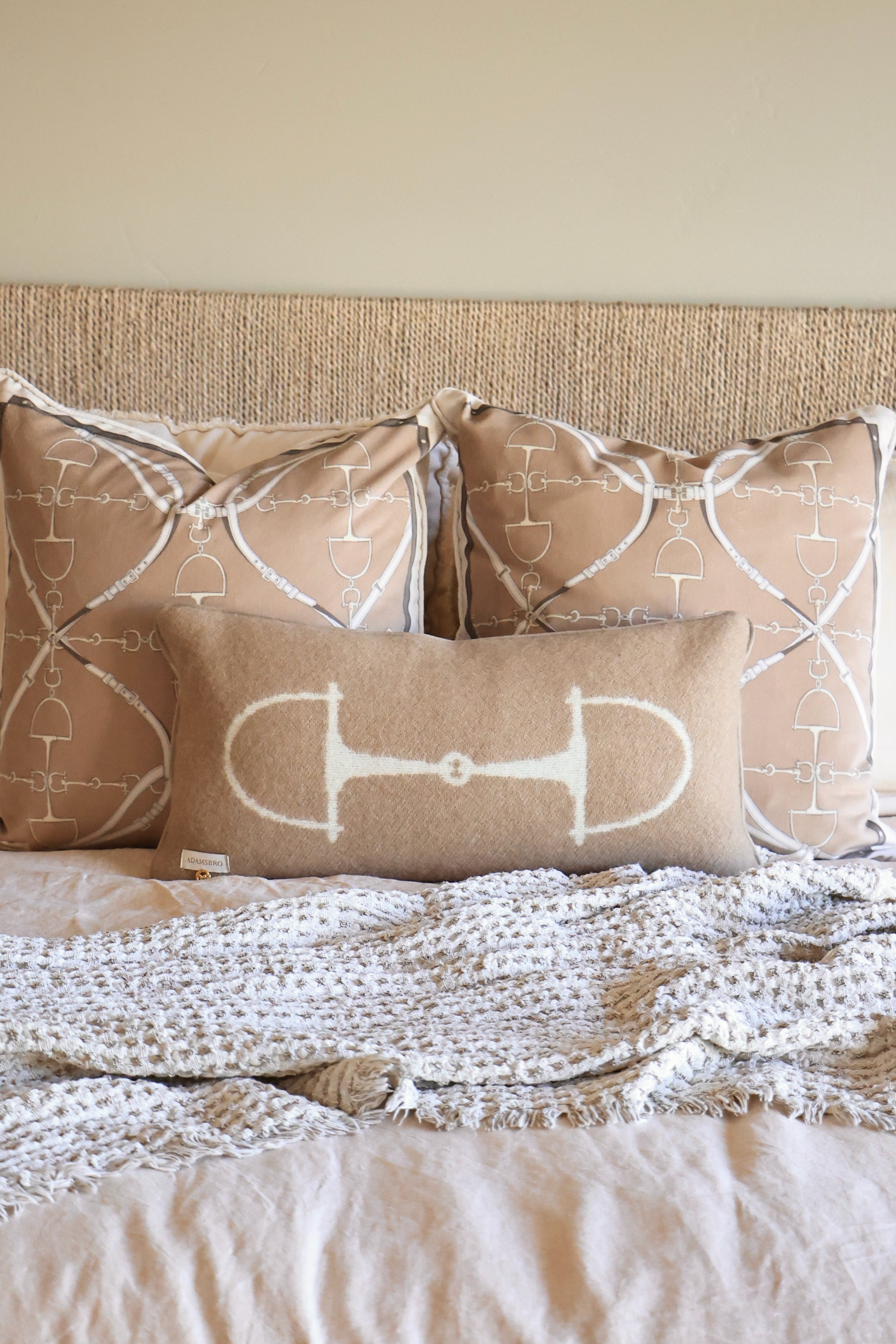 adamsbro stylish equestrian equine wool lumbar pillow Equine Lumbar Wool Pillow in Spice featuring a rich wool fabric with an elegant horse bit design, faux suede piping, and hidden zipper. A luxurious equestrian-inspired accent pillow perfect for home décor or bedding.
