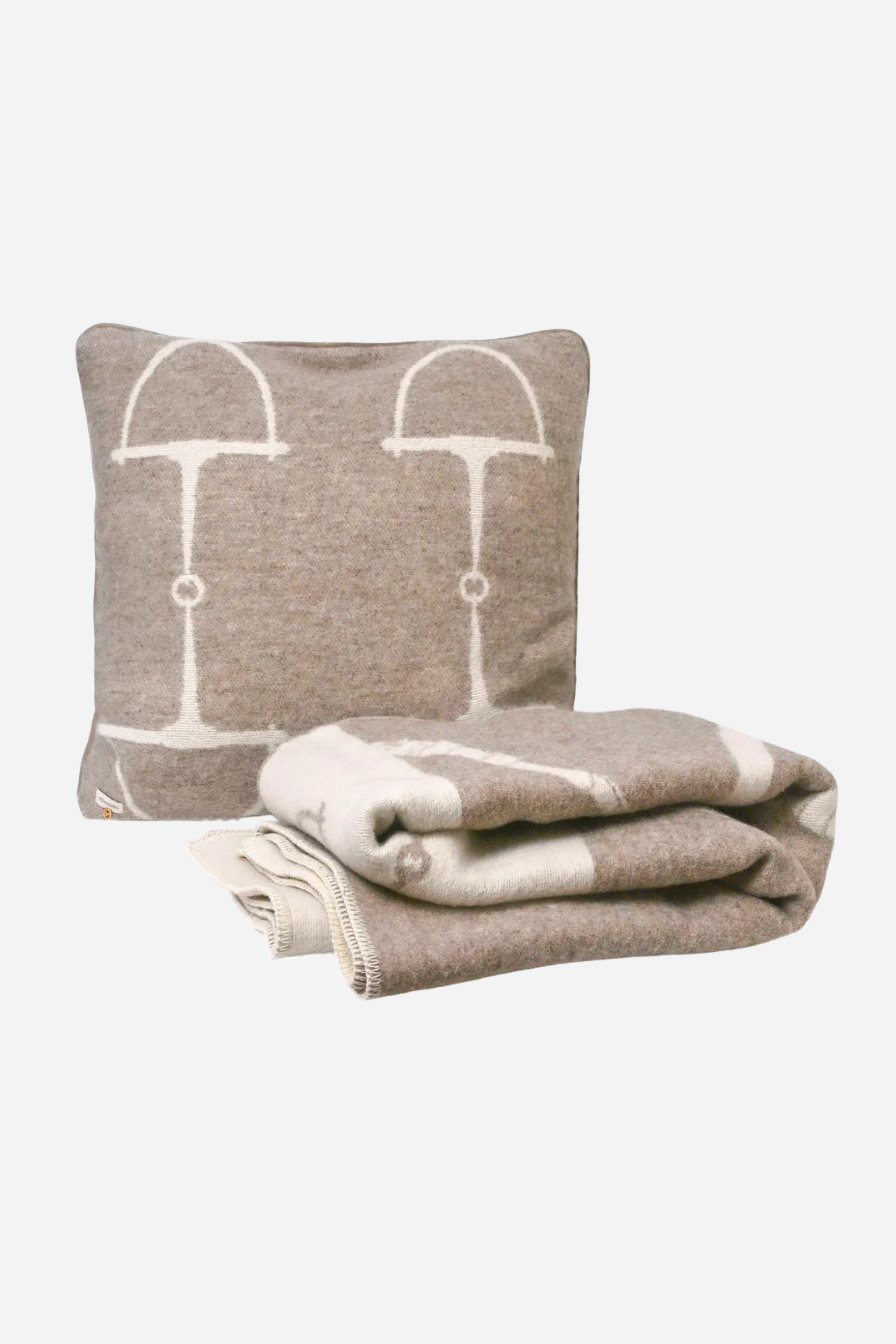 Adamsbro Equine Wool Pillow - Vanilla Bean | Luxury rectangular cushion handcrafted in Sweden from 100% New Zealand lambswool featuring an equestrian pattern, soft faux suede piping, and filled with plush duck feathers, a Scandinavian-inspired accent pillow
