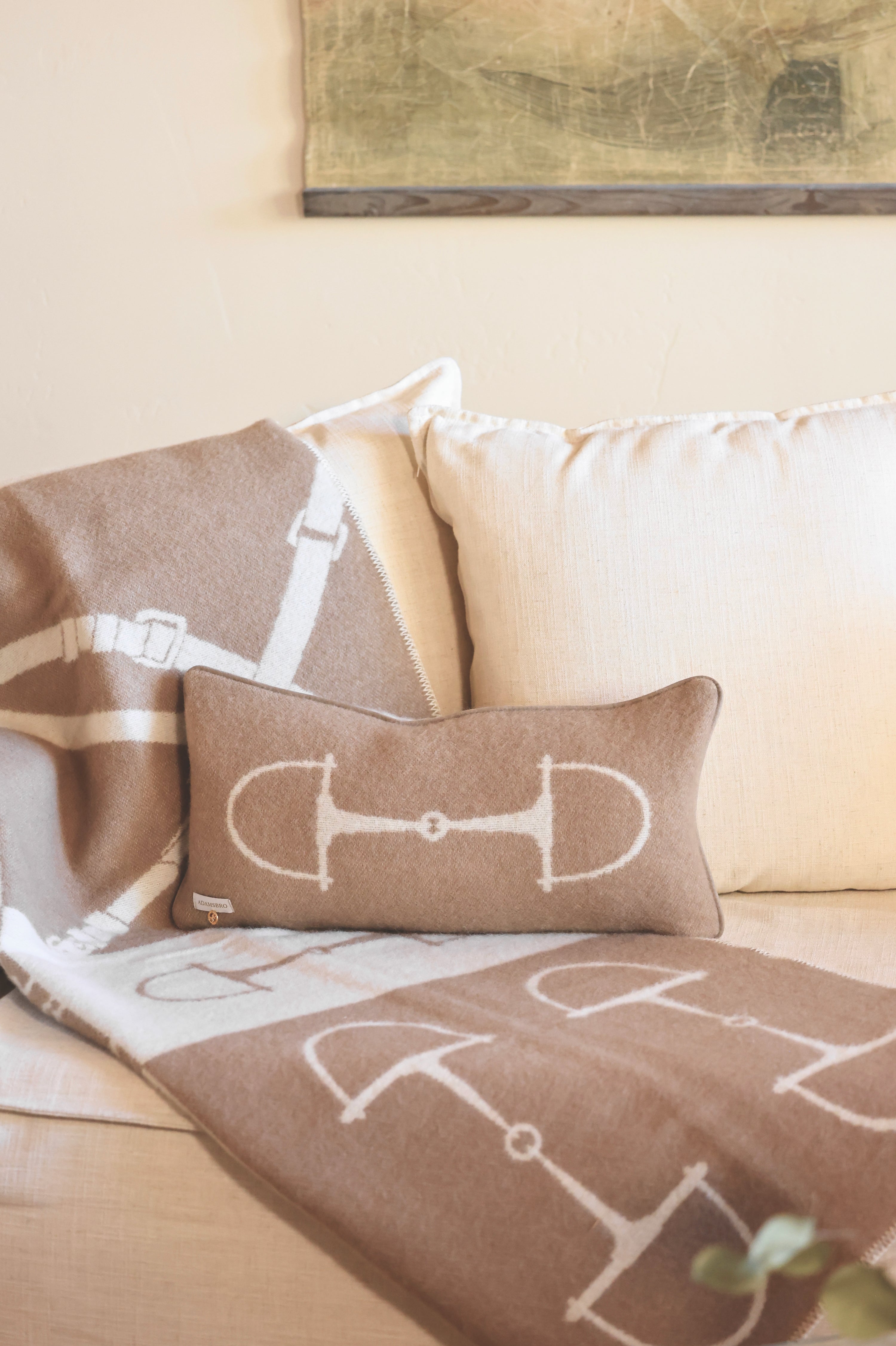 adamsbro stylish equestrian equine wool lumbar pillow Equine Lumbar Wool Pillow in Spice featuring a rich wool fabric with an elegant horse bit design, faux suede piping, and hidden zipper. A luxurious equestrian-inspired accent pillow perfect for home décor or bedding.