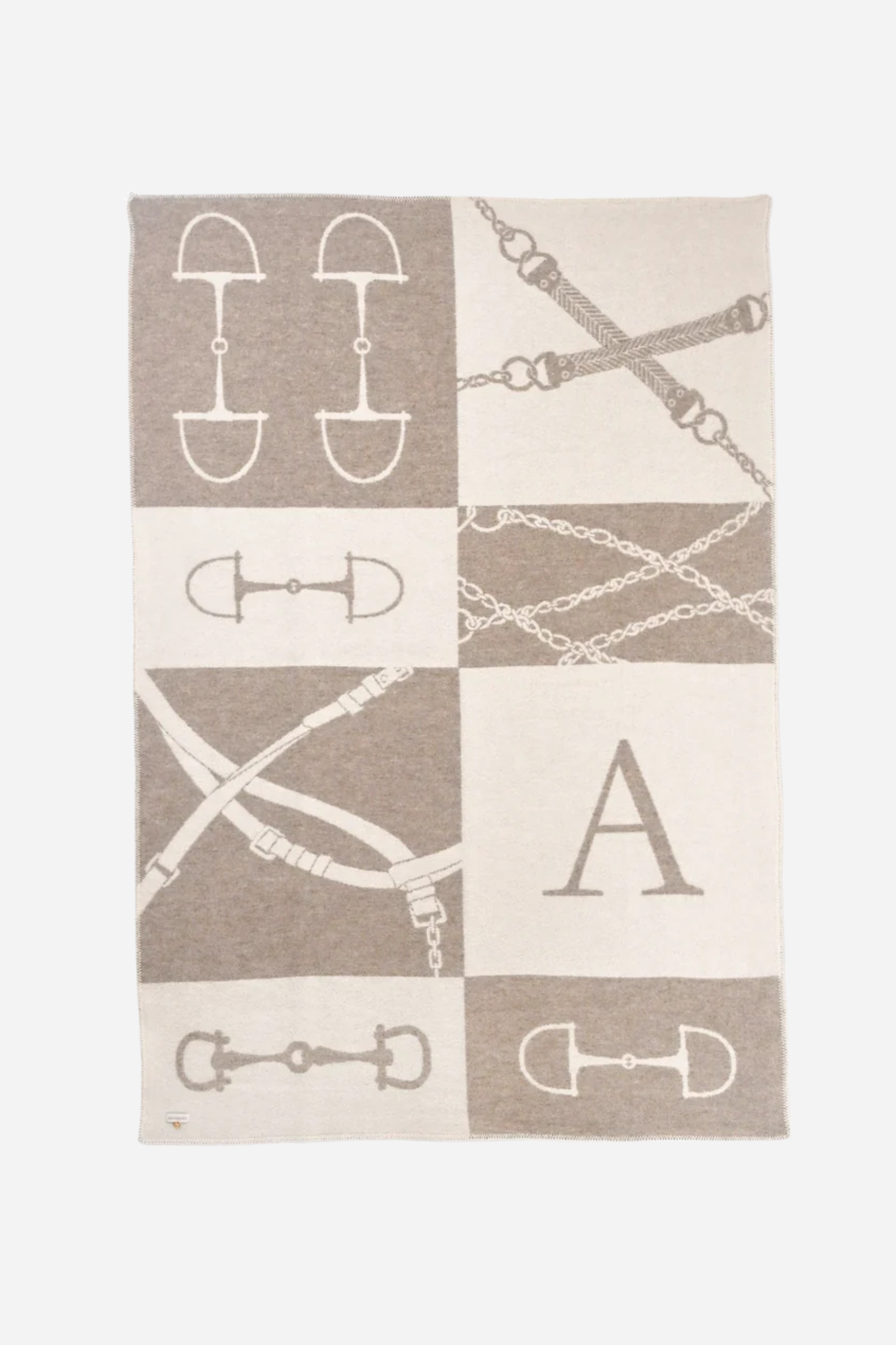 Equine Wool Throw - Vanilla Bean | Classic equestrian-inspired wool throw blanket in vanilla bean, crafted from 100% New Zealand lambswool. Features a reversible horse bit pattern, soft and breathable texture, and Scandinavian design, perfect for layering on sofas, beds, or armchairs in timeless, natural interiors
