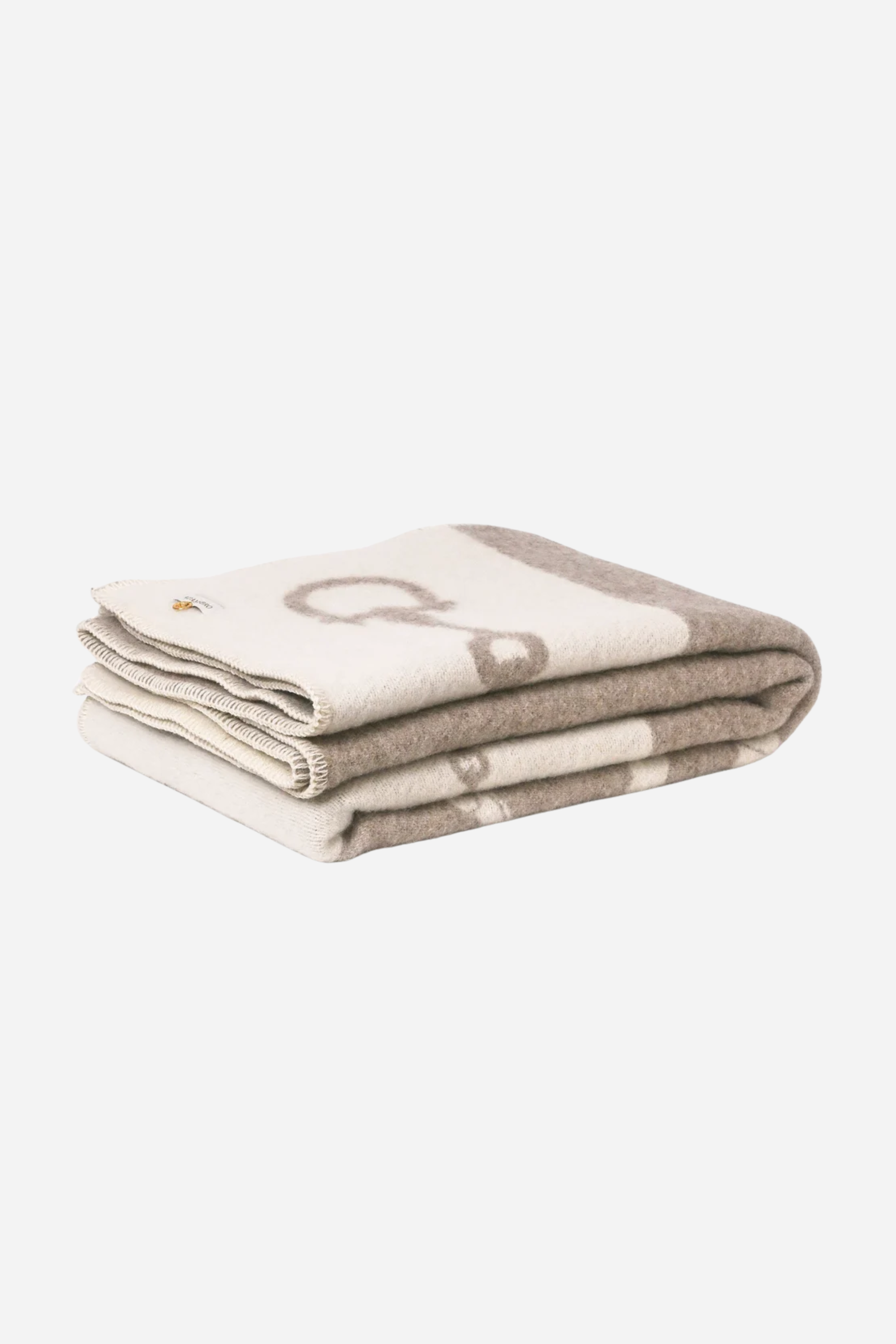 Equine Wool Throw - Vanilla Bean | Classic equestrian-inspired wool throw blanket in vanilla bean, crafted from 100% New Zealand lambswool. Features a reversible horse bit pattern, soft and breathable texture, and Scandinavian design, perfect for layering on sofas, beds, or armchairs in timeless, natural interiors
