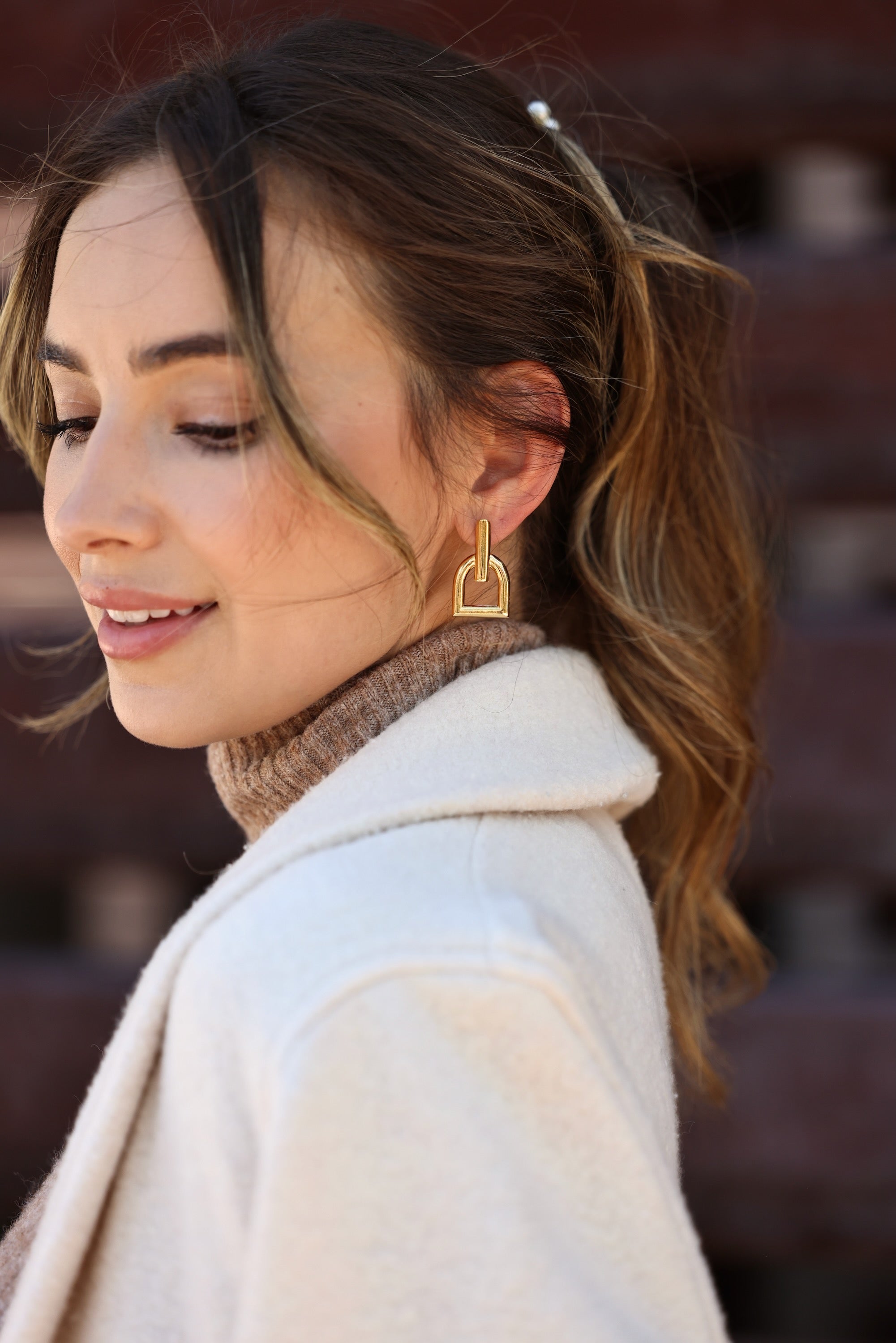 cxc stylish equestrian hallie stirrup earrings | Stirrup-inspired earrings with a stud back closure, crafted from metal alloy and finished in gold plating.