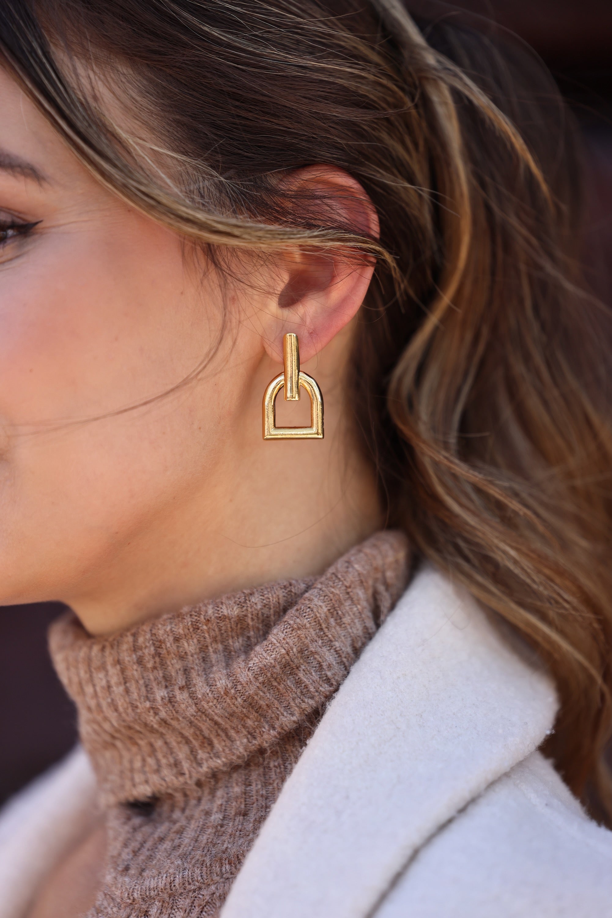 cxc stylish equestrian hallie stirrup earrings | Stirrup-inspired earrings with a stud back closure, crafted from metal alloy and finished in gold plating.