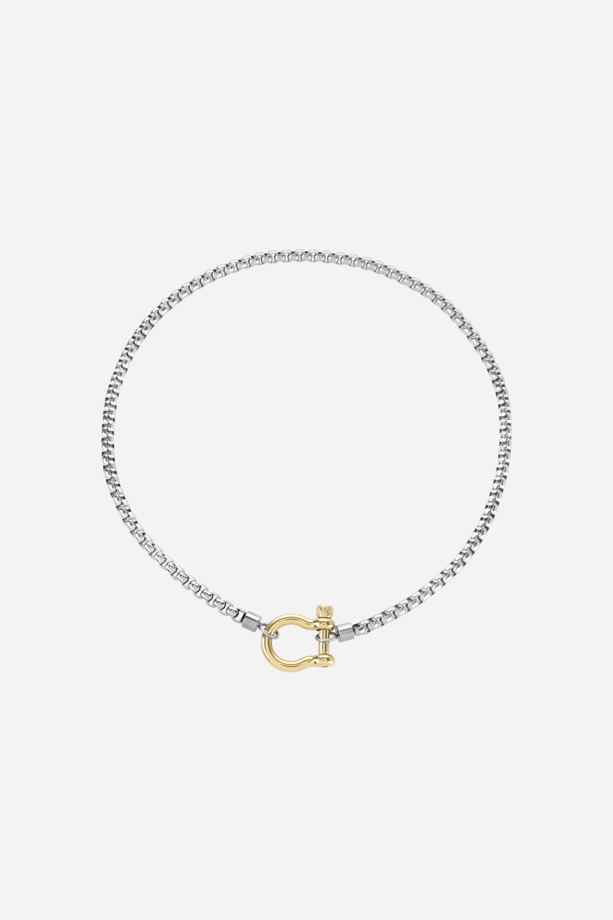 Upscale equestrian mixed metal horseshoe necklace featuring an 18k gold plated horseshoe clasp and stainless steel chain, tarnish resistant and hypoallergenic.