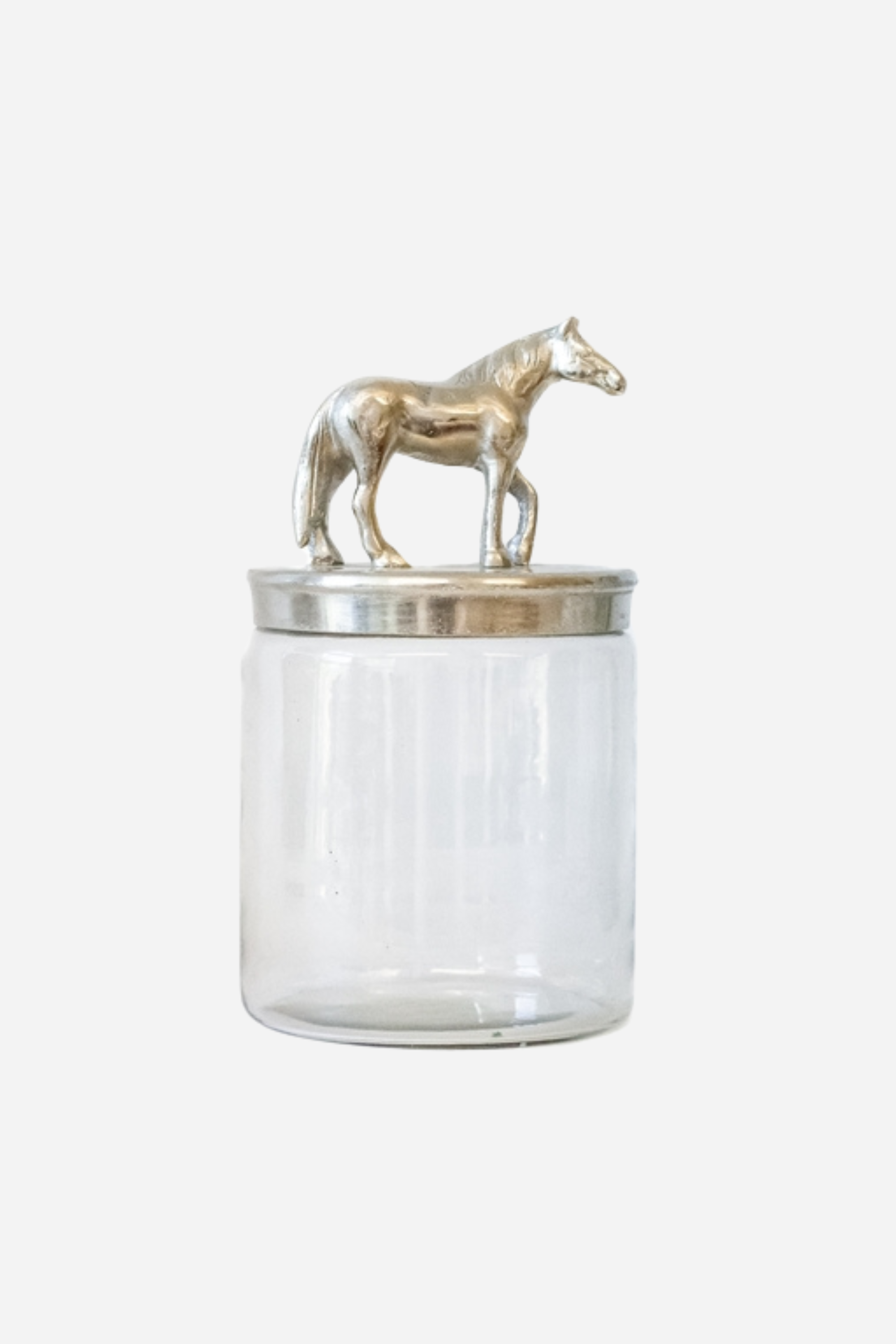 Clear glass storage jar with a brushed silver aluminum lid featuring a sculpted horse accent.