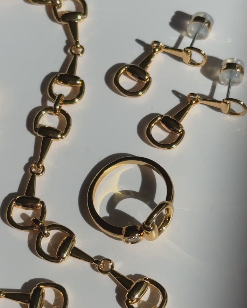 Luv AJ Madison Ring - Gold Statement ring with horsebit charm and stone in the center
