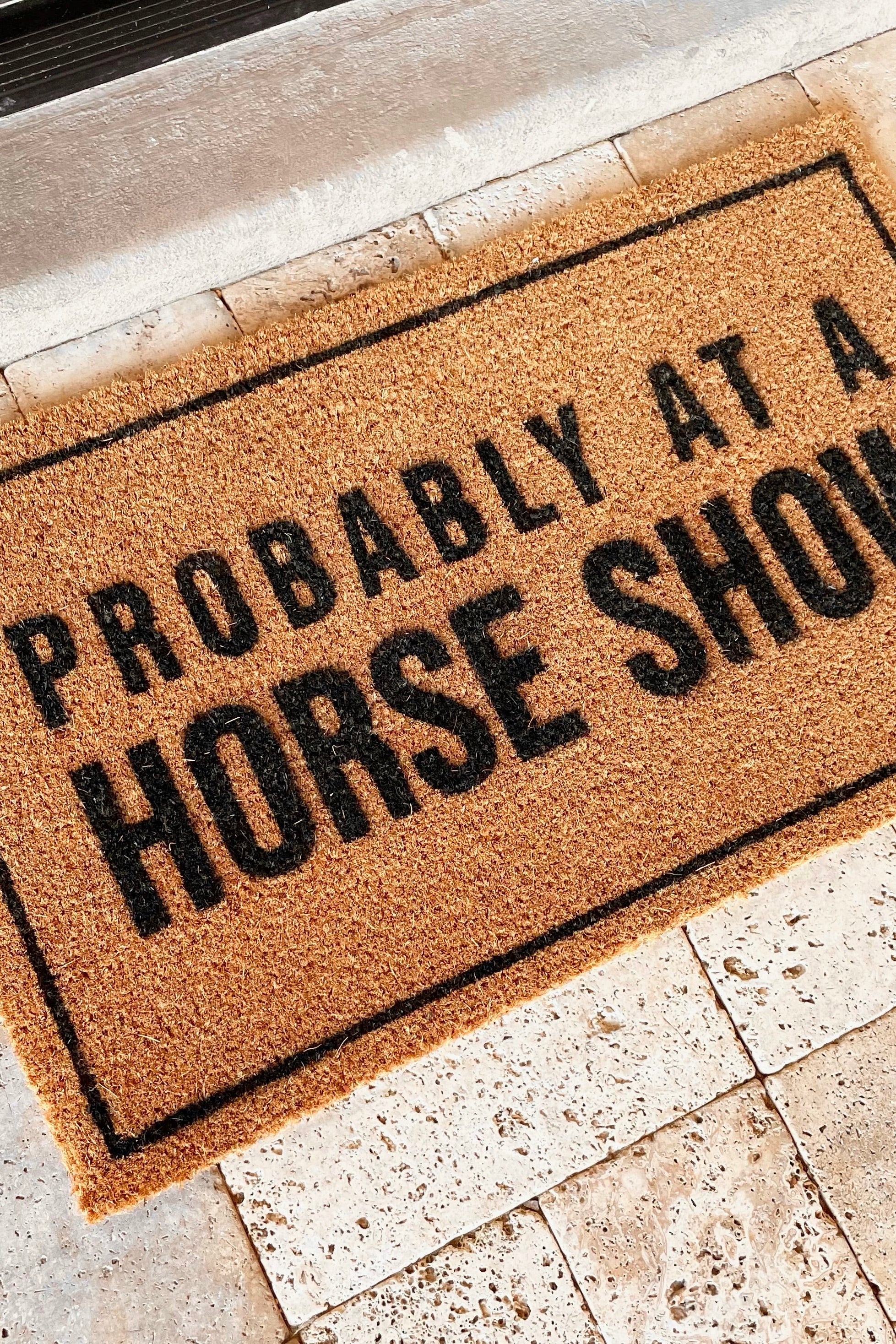 cocomats stylish equestrian probably at a horse show doormat