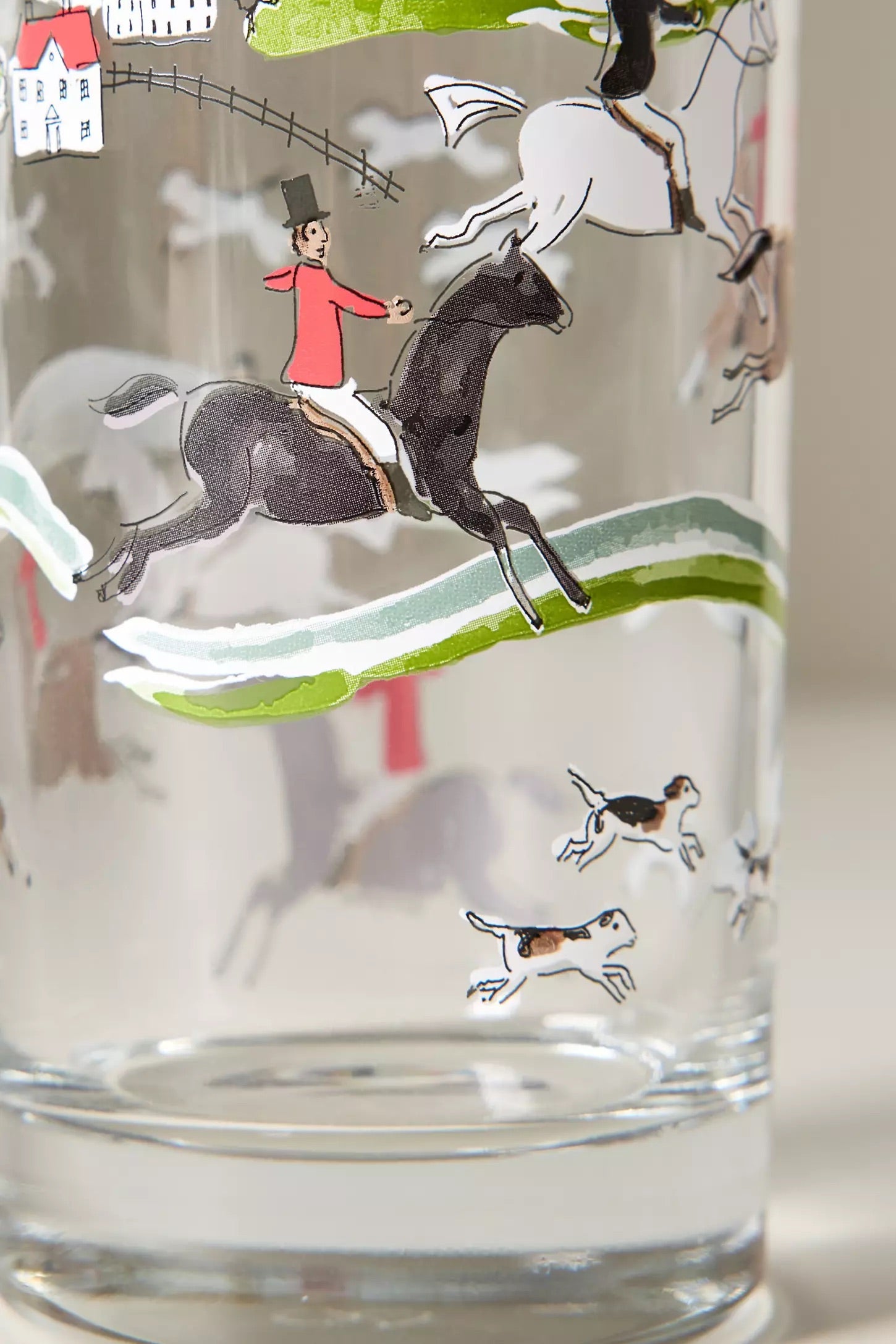 pomegranate inc stylish equestrian the hunt scene tall drinking glass set The Hunt Scene Drinking Glass Set featuring four tall glasses adorned with a detailed equestrian hunt scene and finished with elegant gold rims. A sophisticated horse-themed glassware set perfect for entertaining or gifting.