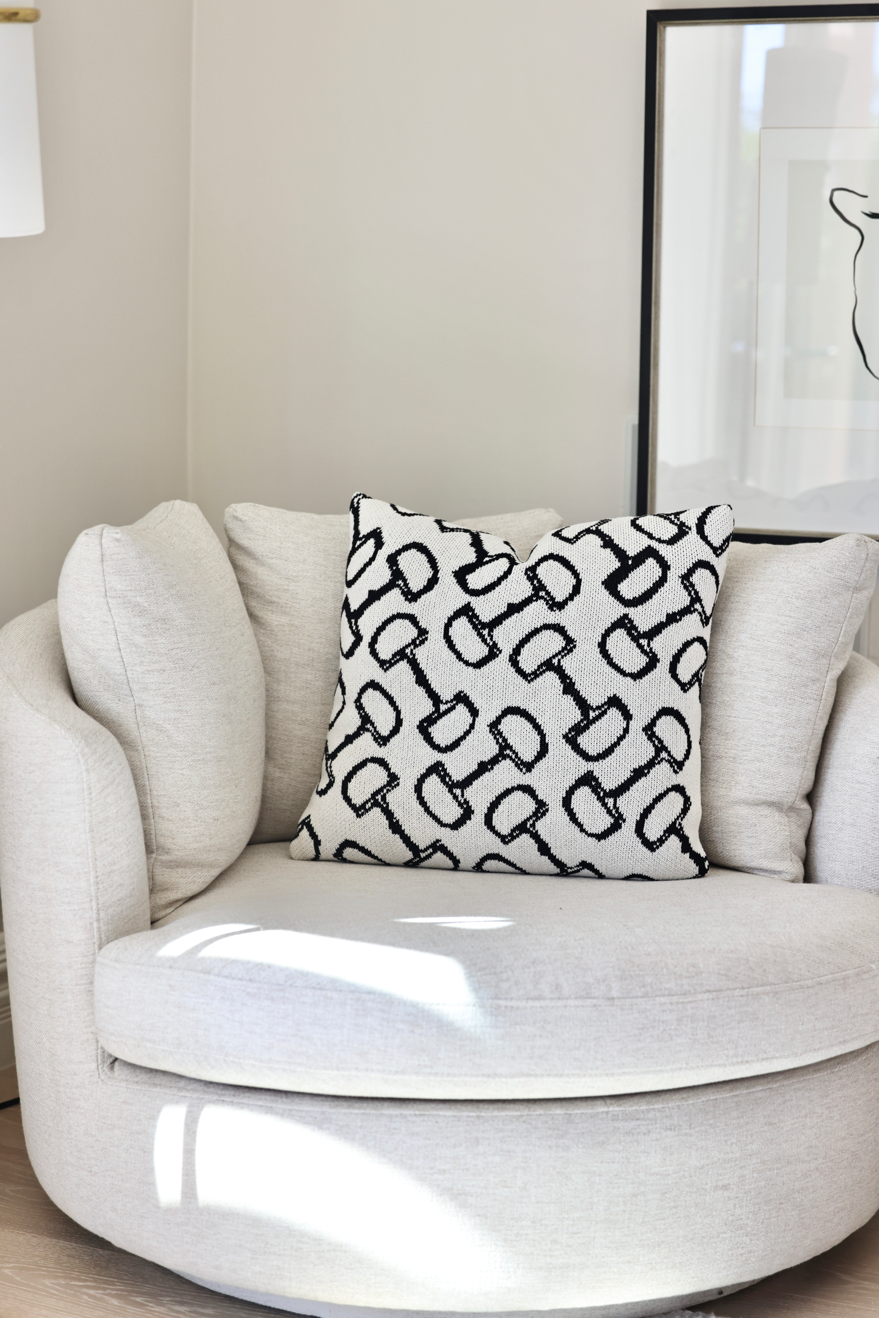 Twilight Pillow by Stylish Equestrian — a 20x20 luxury decorative pillow featuring a classic equestrian bit pattern in soft ivory and midnight black tones. Crafted from a plush cotton blend with insert included, this elegant home accent adds sophistication and comfort to any space. Made in the USA. equestrian home decor, horse themed pillow, luxury equestrian throw pillow, bit pattern cushion, equestrian living room decor, black and ivory pillow, horse lover home accents, elegant equestrian gift