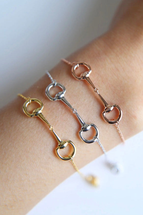 stylish equestrian dainty horse bit bracelet | Equestrian-inspired sterling silver bracelet featuring a delicate chain and center horse bit detail, adjustable for fit.