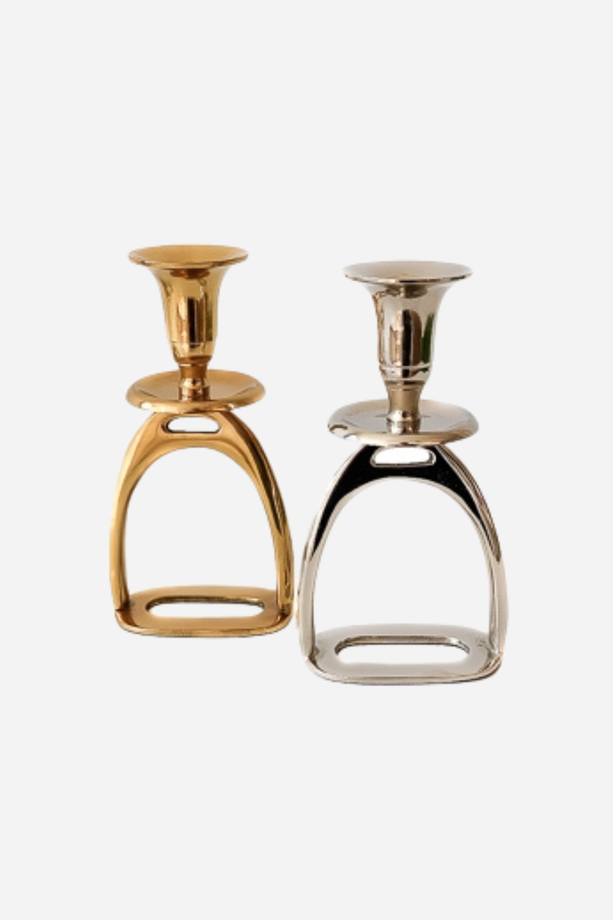thg stylish equestrian brass stirrup candle stick holder set Silver Stirrup Candle Holder featuring a polished equestrian stirrup design that holds tapered candles. Available in small (6") and large (10") sizes, this elegant home accent adds refined equestrian charm to any space.