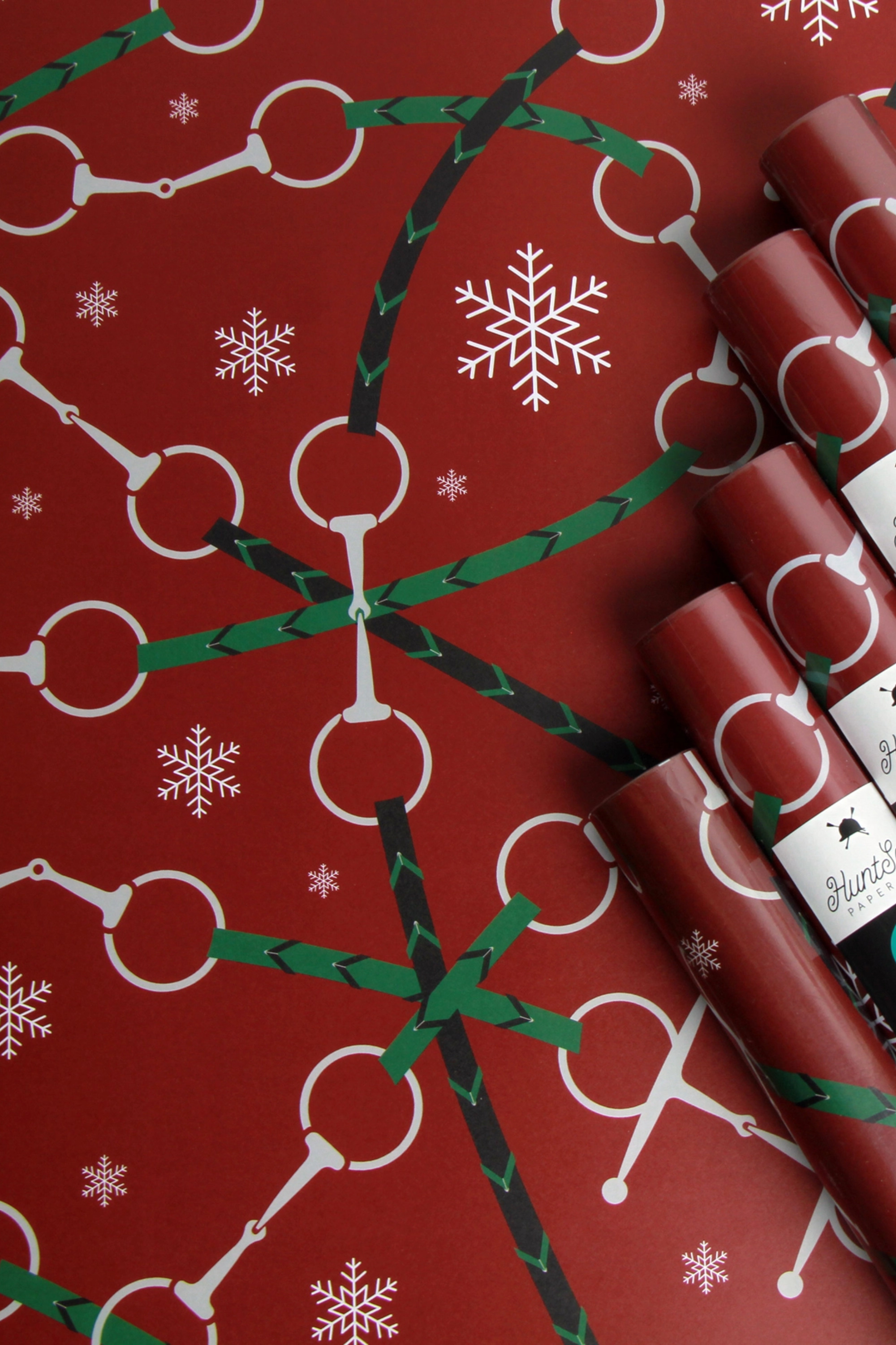 Set of three festive equestrian gift wrap sheets featuring a repeating pattern of horse bits and reins printed on luxurious, subtly textured high-quality paper. Perfect for holiday gifts, horse lovers, and equestrian-inspired packaging. Made in the USA. equestrian gift wrapping paper, horse themed wrapping paper, horse bit gift wrap sheets, holiday equestrian wrapping paper, luxury horse wrapping paper, equestrian stationery, elegant horse gift wrap, horse lover gift wrap, premium horse gift wrap