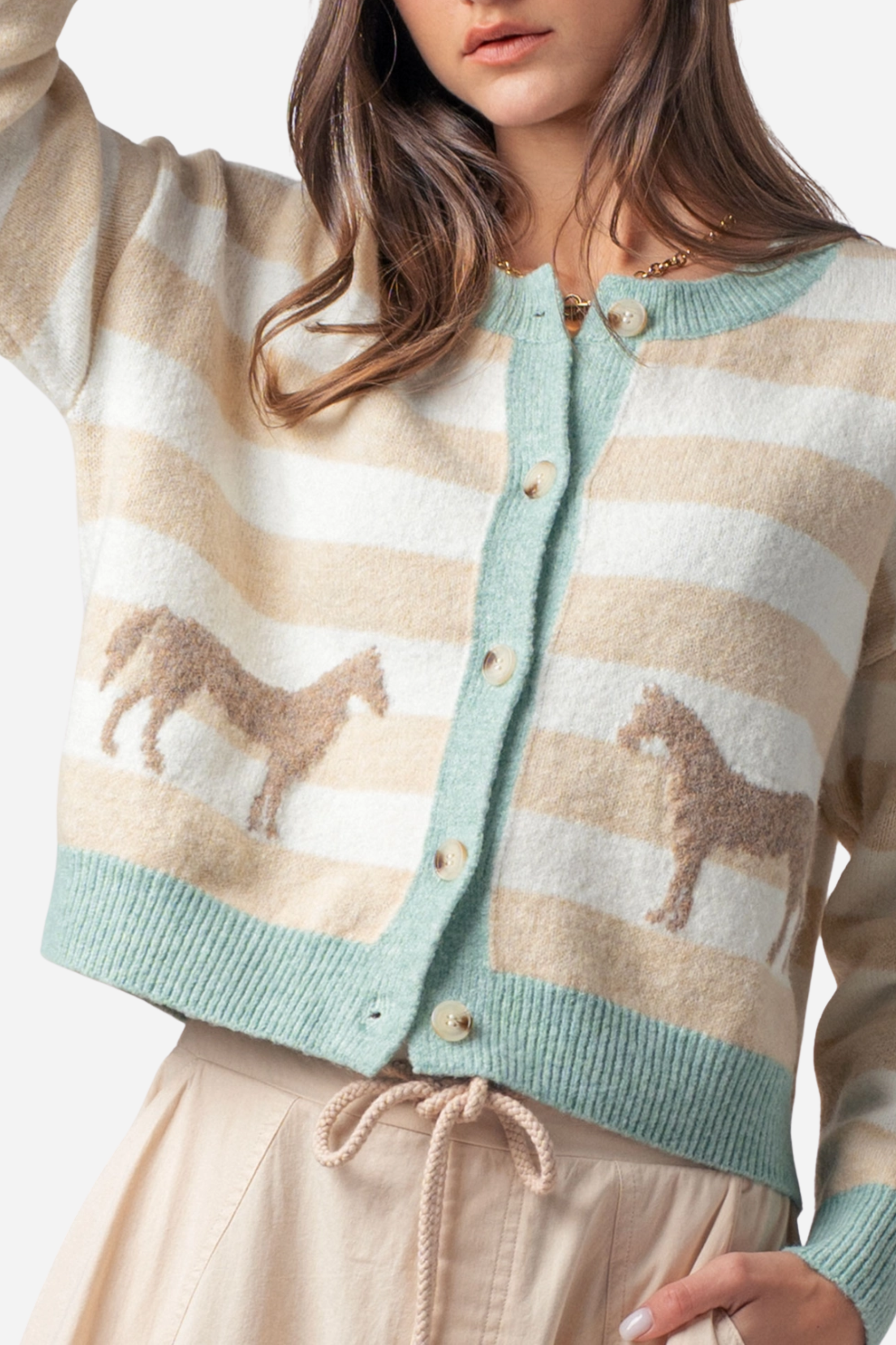 Cozy striped crew neck cardigan with twin horse jacquard motifs on the front, featuring a relaxed fit, full button-front closure, and ribbed trim at the neckline, cuffs, and hem.