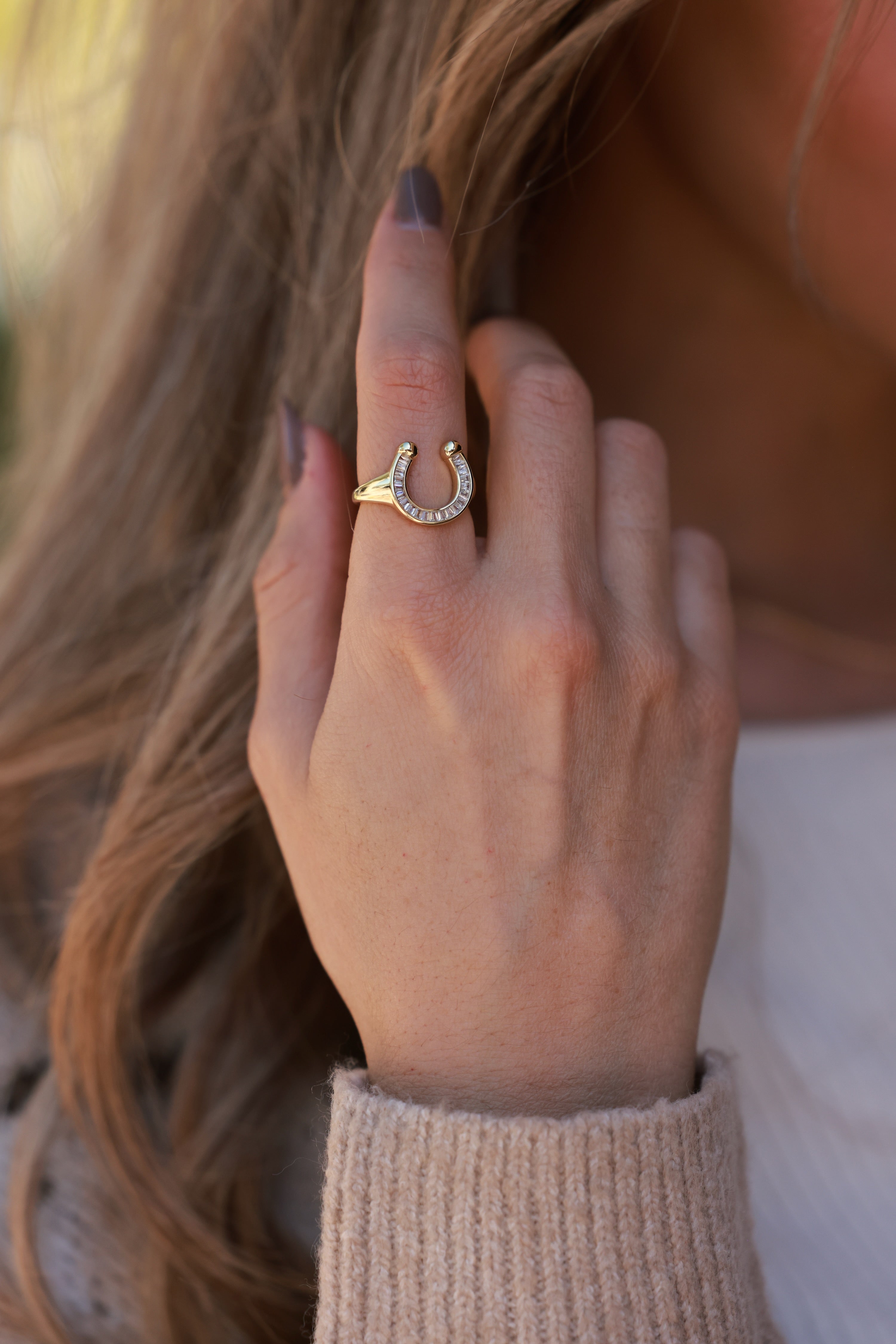 Elegant 18k gold-plated stainless steel horseshoe signet ring with sparkling CZ details. Water- and tarnish-resistant, hypoallergenic equestrian jewelry — a modern, playful twist on the classic horseshoe symbol.
