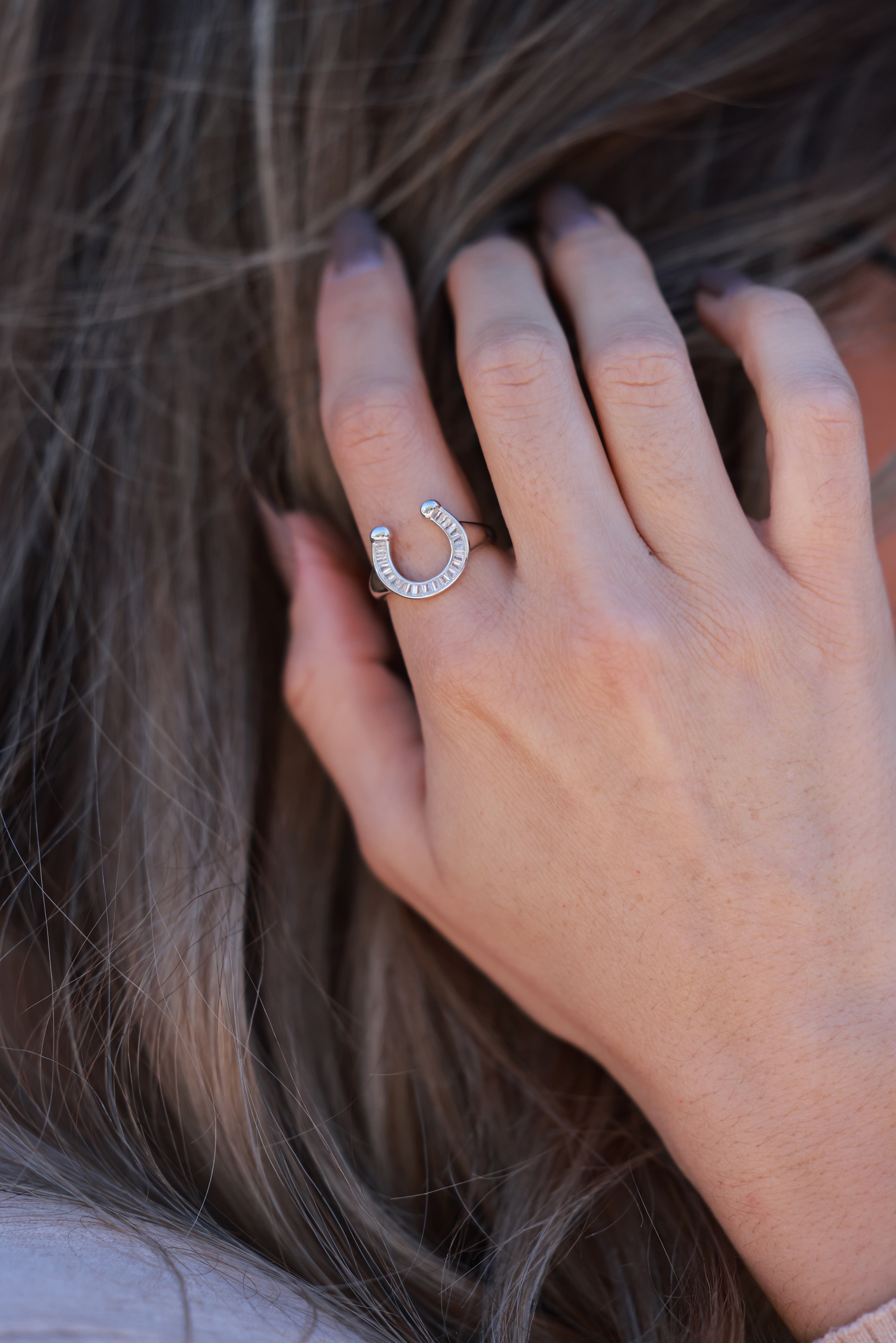 Devon Horseshoe Signet Ring in 18k gold-plated stainless steel with CZ accents. Water- and tarnish-resistant, hypoallergenic equestrian ring offering a chic, modern twist on the classic horseshoe design — perfect gift for horse lovers.
