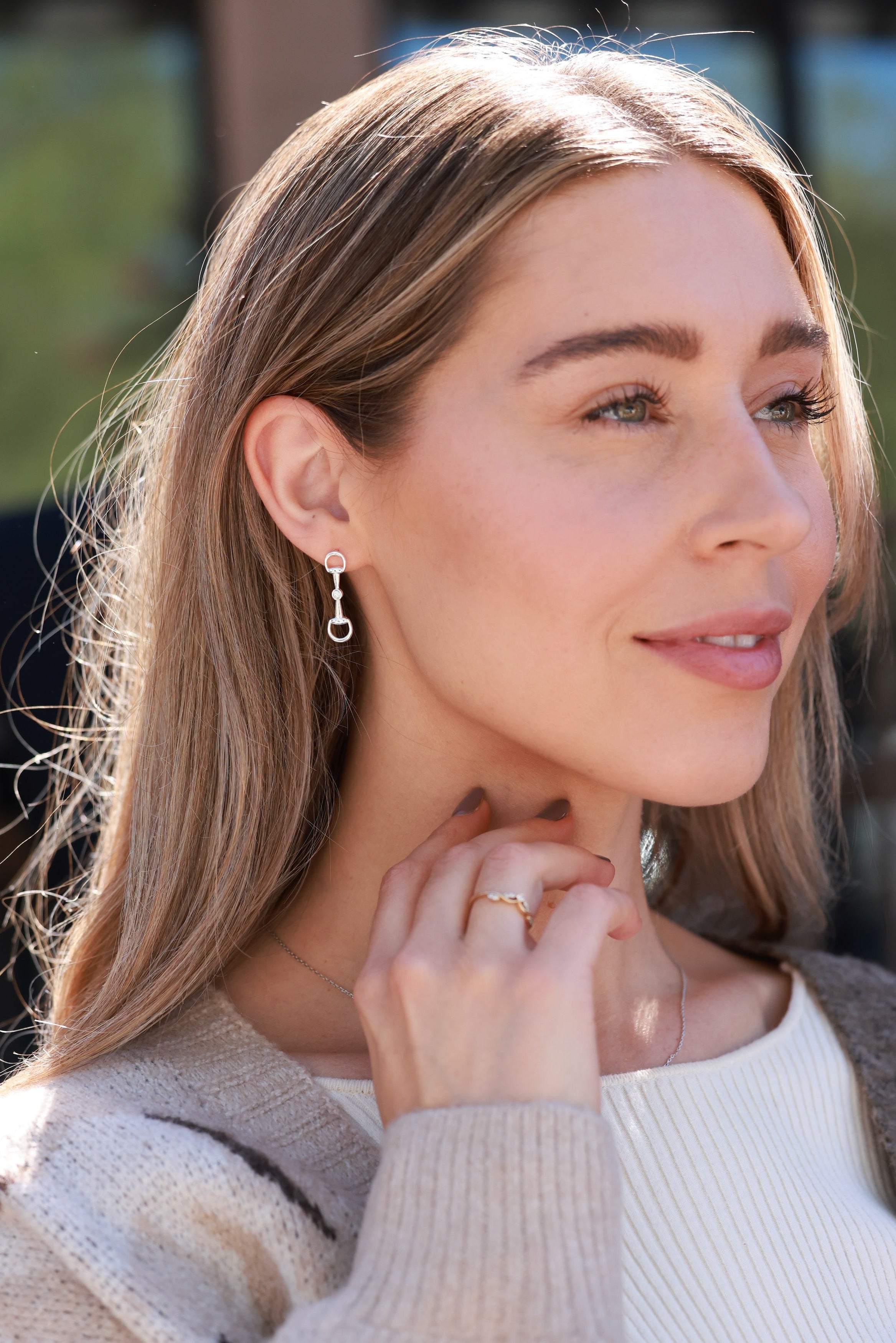 Silver equestrian bit drop earrings with crystal accents, lightweight horse girl jewelry, dainty CZ stud earrings, elegant gift for equestrian lovers.