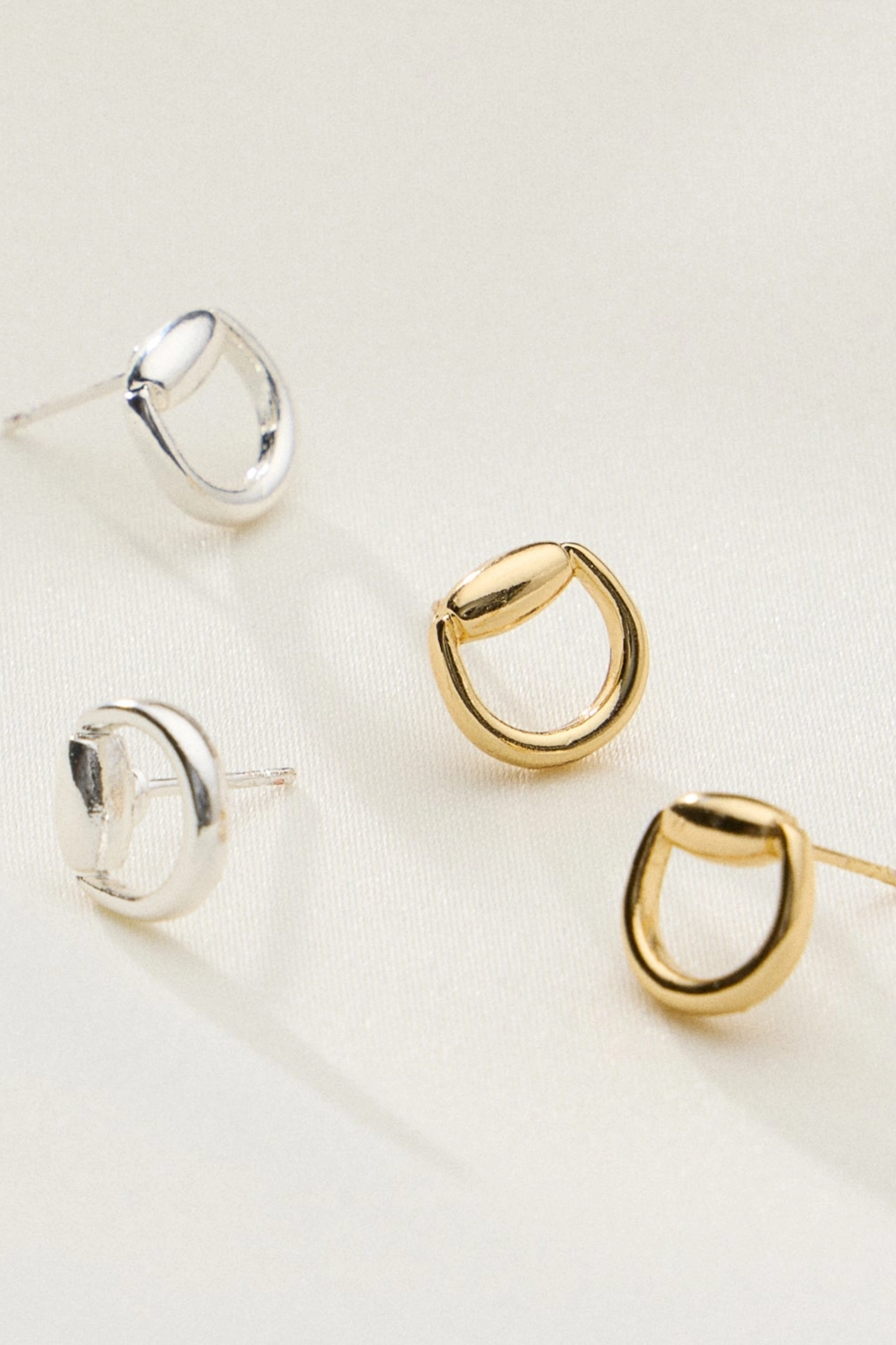 18k gold plated Hollis bit stud earrings with a minimalist half snaffle horse bit design, lightweight everyday equestrian jewelry. bit stud earrings, silver stud earrings, minimalist earrings, dainty stud earrings, everyday earrings, classic stud earrings