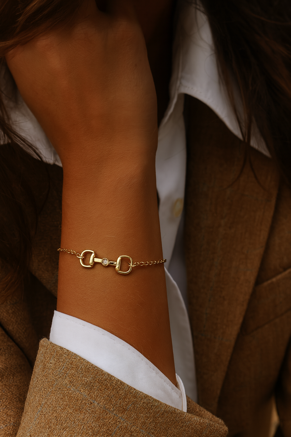 Gold bracelet on a wrist with a blurred background -  equestrian inspired jewelry, horse girl accessory, horseshoe pendant necklace, dainty equestrian jewelry, small gifts for horse lovers