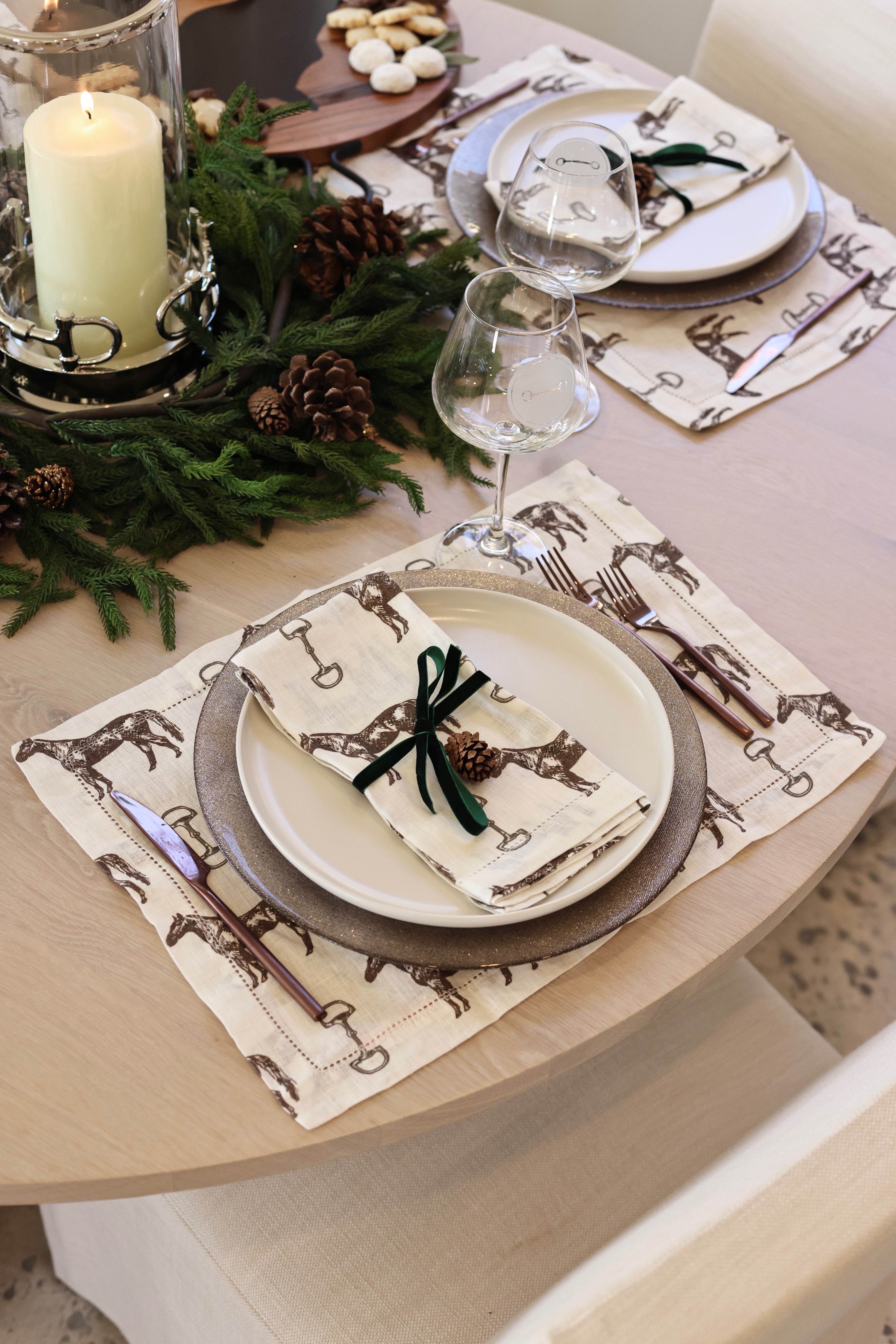 Horse & Snaffle Linen Placemat Set featuring a hand-sketched design of horses and snaffle bits on white linen with a stitched border. Set of four elegant 13x19" placemats perfect for equestrian-inspired table settings.