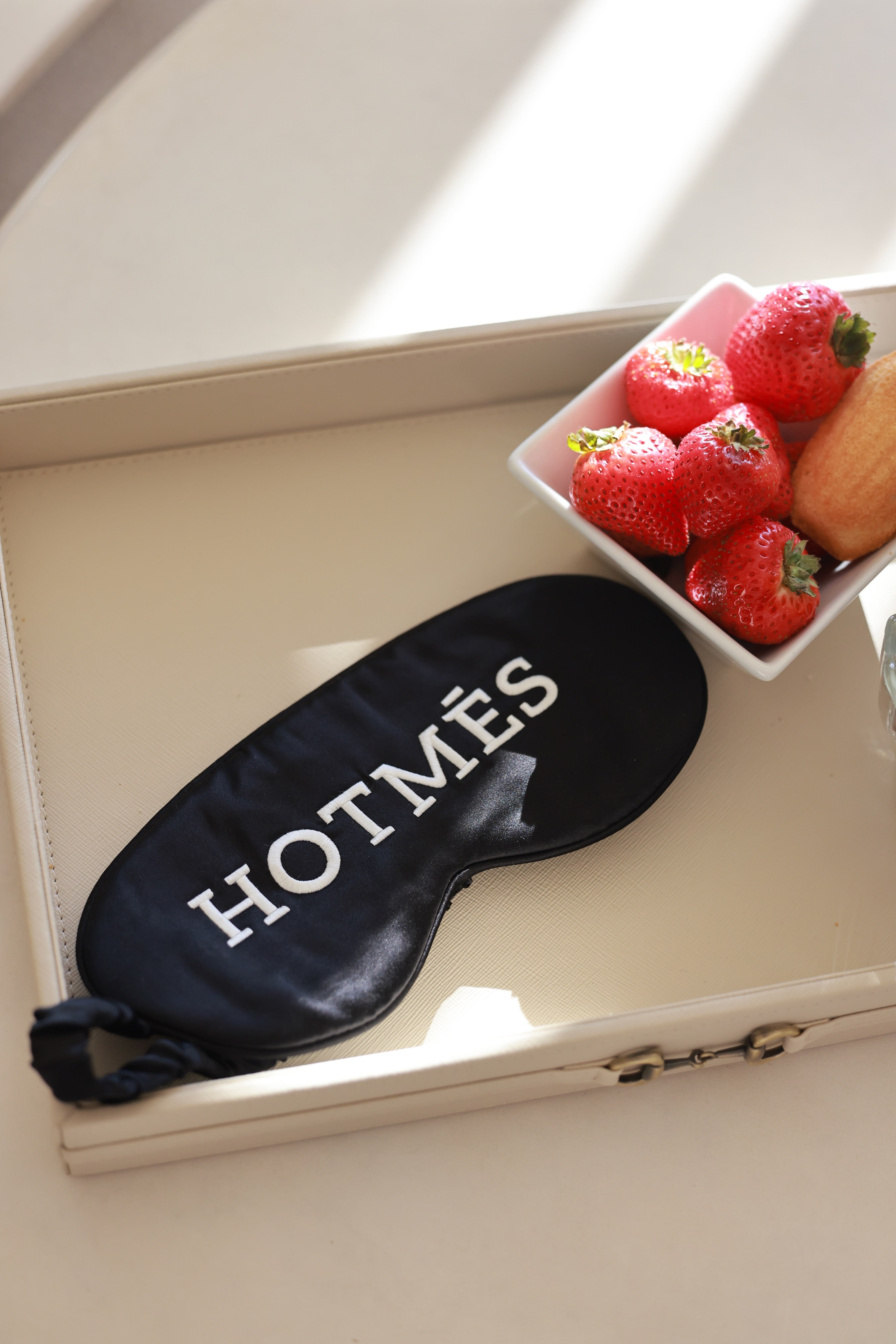 Hotmés Silk Sleep Mask made from 100% silk with front embroidery and elastic strap. Luxurious, comfortable, equestrian-inspired sleep accessory.