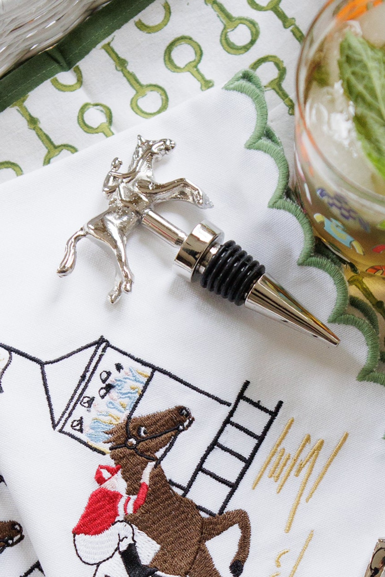 Pomegranate Jockey Bottle Stopper - Silver Elevate your entertaining with the Silver Jockey Bottle Stopper. Crafted with a charming horse & jockey design, this stopper not only preserves your wine's freshness but also adds a touch of equestrian elegance to your barware. Its durable construction ensures a secure fit, making it a delightful gift for horse lovers and wine enthusiasts alike.