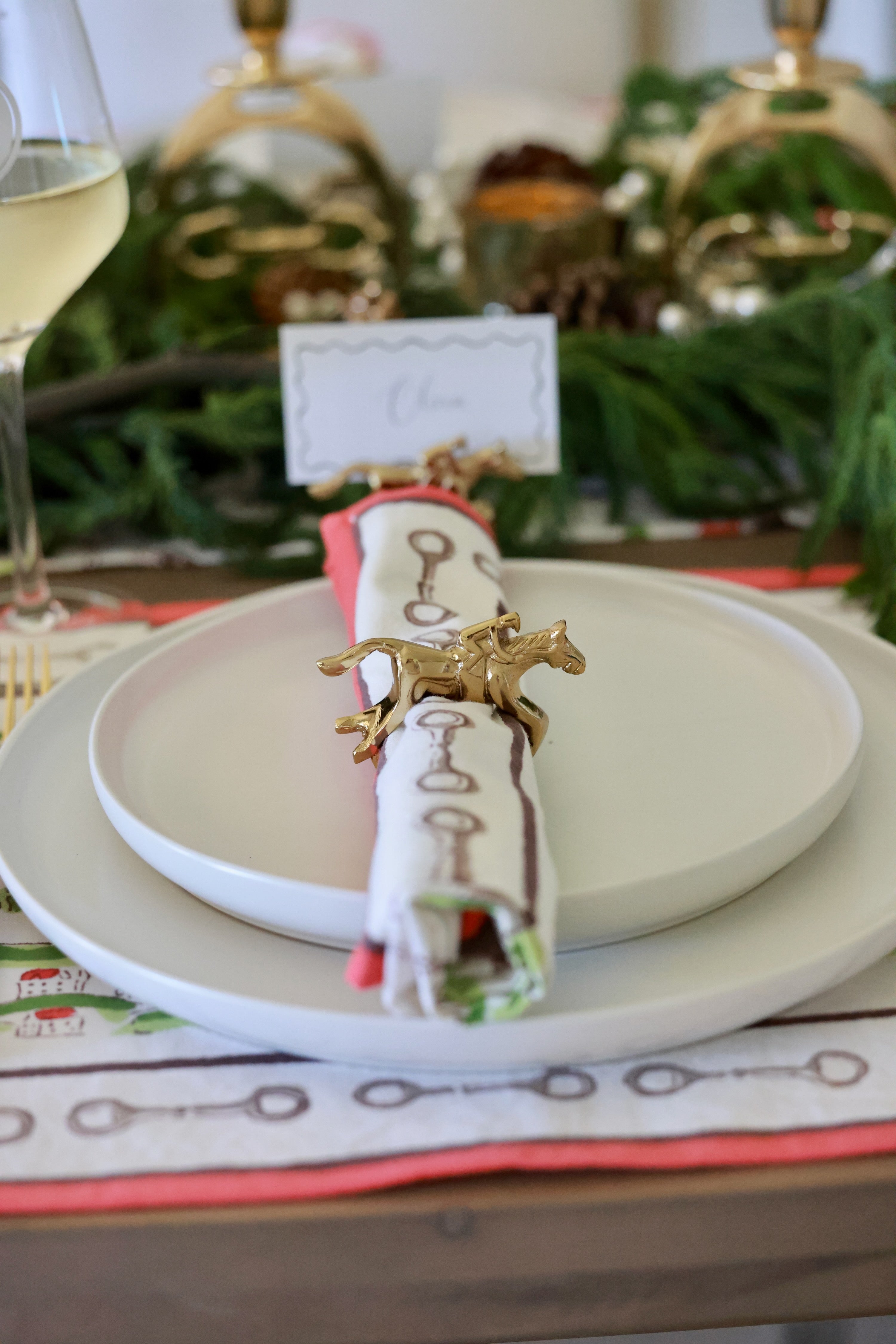 Pomegranate Jockey Napkin Ring Set - Gold Bring a touch of luxury to your table with the Gold Jockey Napkin Rings. This set of four features a stunning horse & jockey design that shines at every gathering. Ideal for formal dinners or casual brunches, these napkin rings are the perfect accessory to elevate your dining decor.