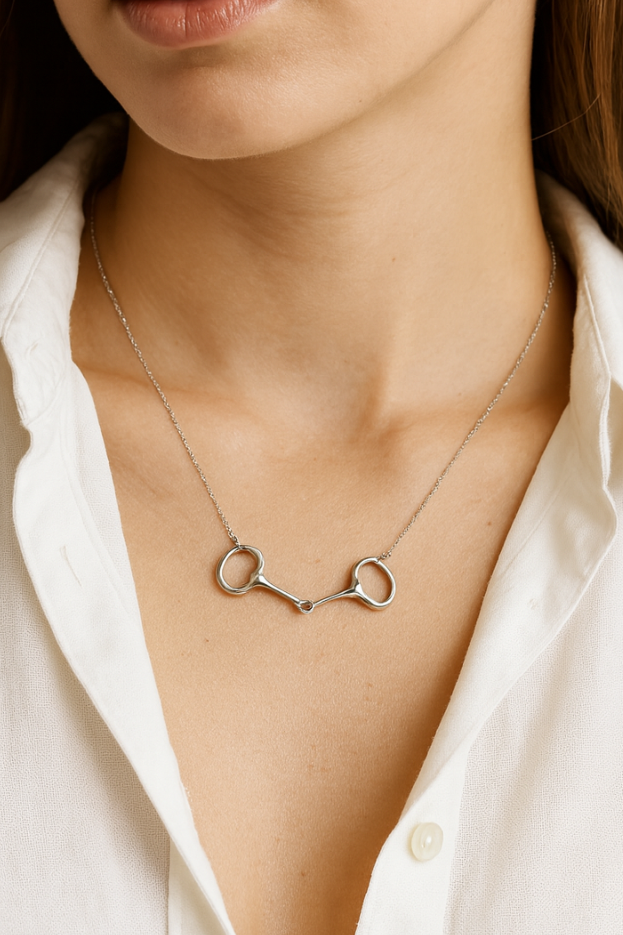 Delicate sterling silver necklace with a dainty horse bit pendant
