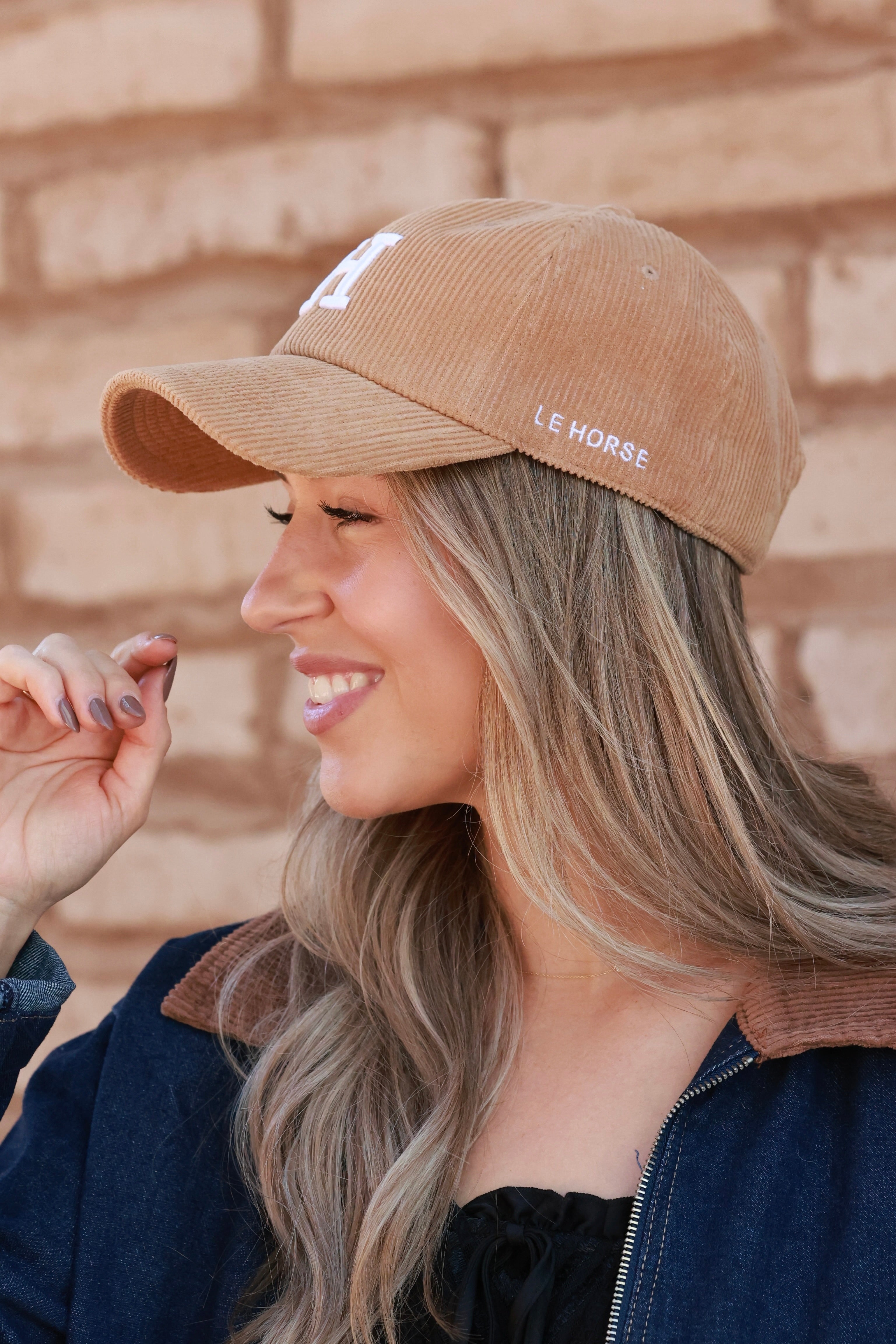 Camel Le Horse Corduroy Cap featuring trendy embroidered ‘H’ front and side Le Horse detail. Unstructured, low-profile six-panel design with pre-curved visor and adjustable strap for a comfortable fit.